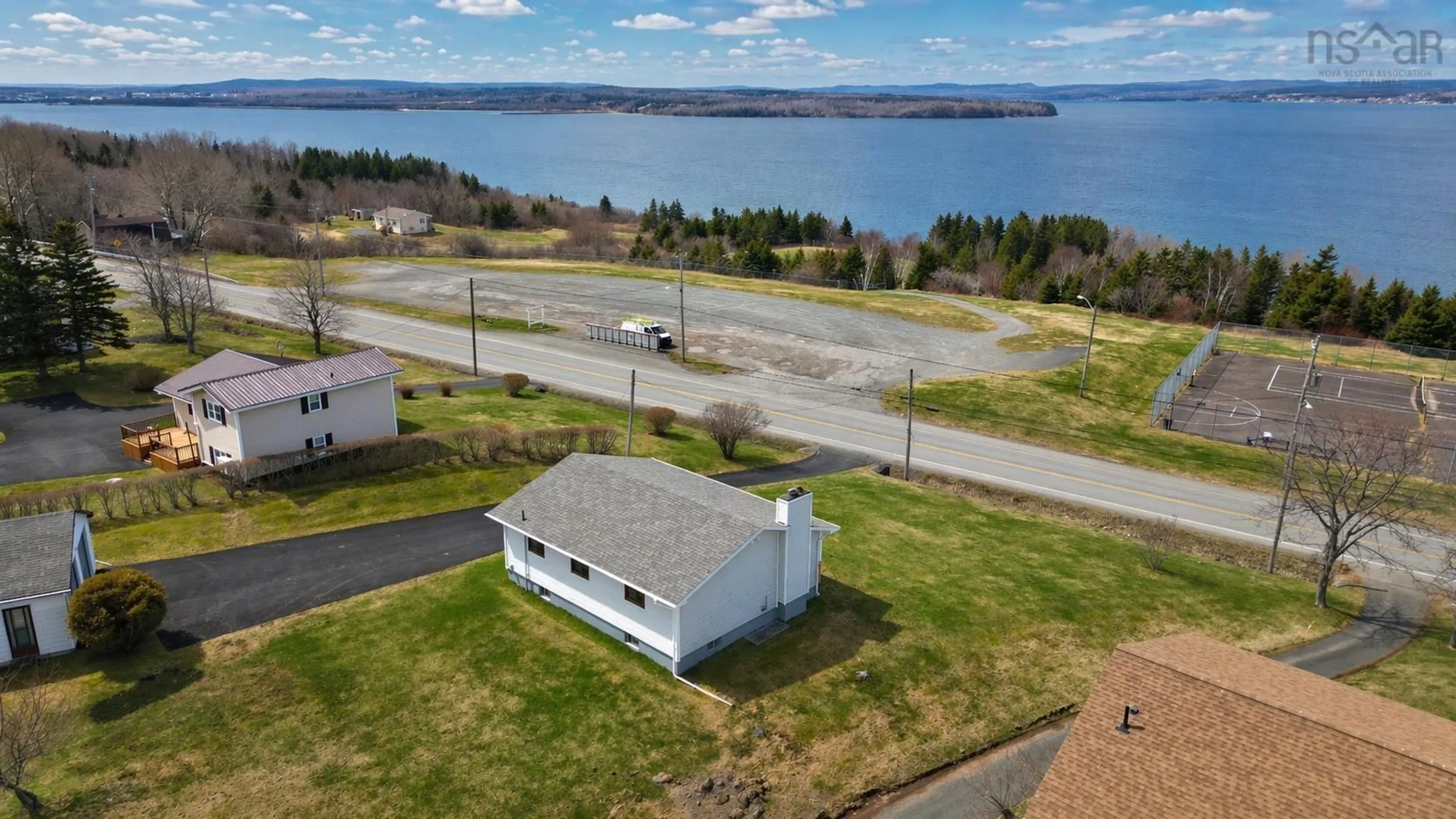 A pic from outside/outdoor area/front of a property/back of a property/a pic from drone, water/lake/river/ocean view for 2190 Highway 28, South Bar Nova Scotia B1N 3H7