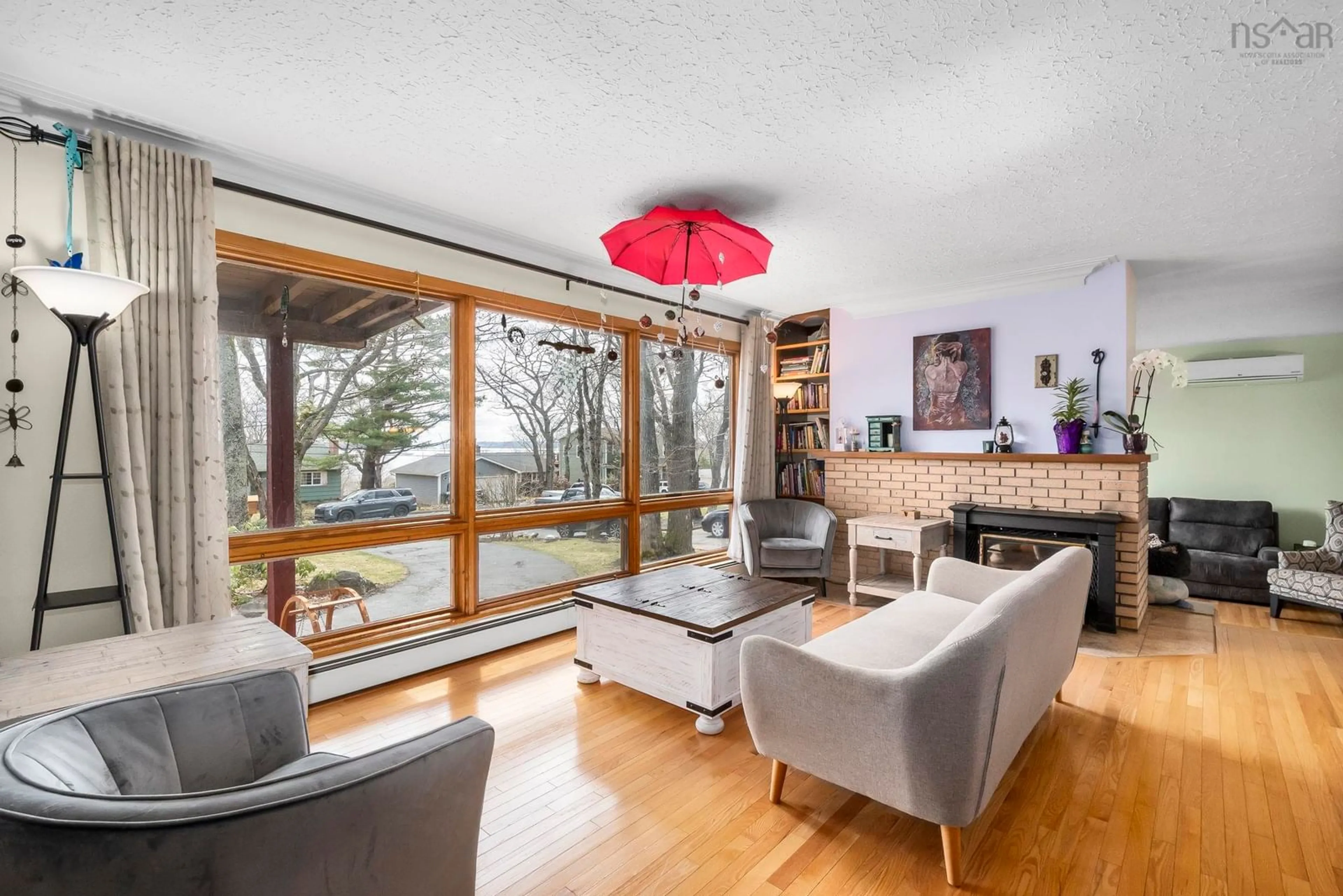 Living room with furniture, wood/laminate floor for 12 Campbell Dr, Bedford Nova Scotia B4A 1N6