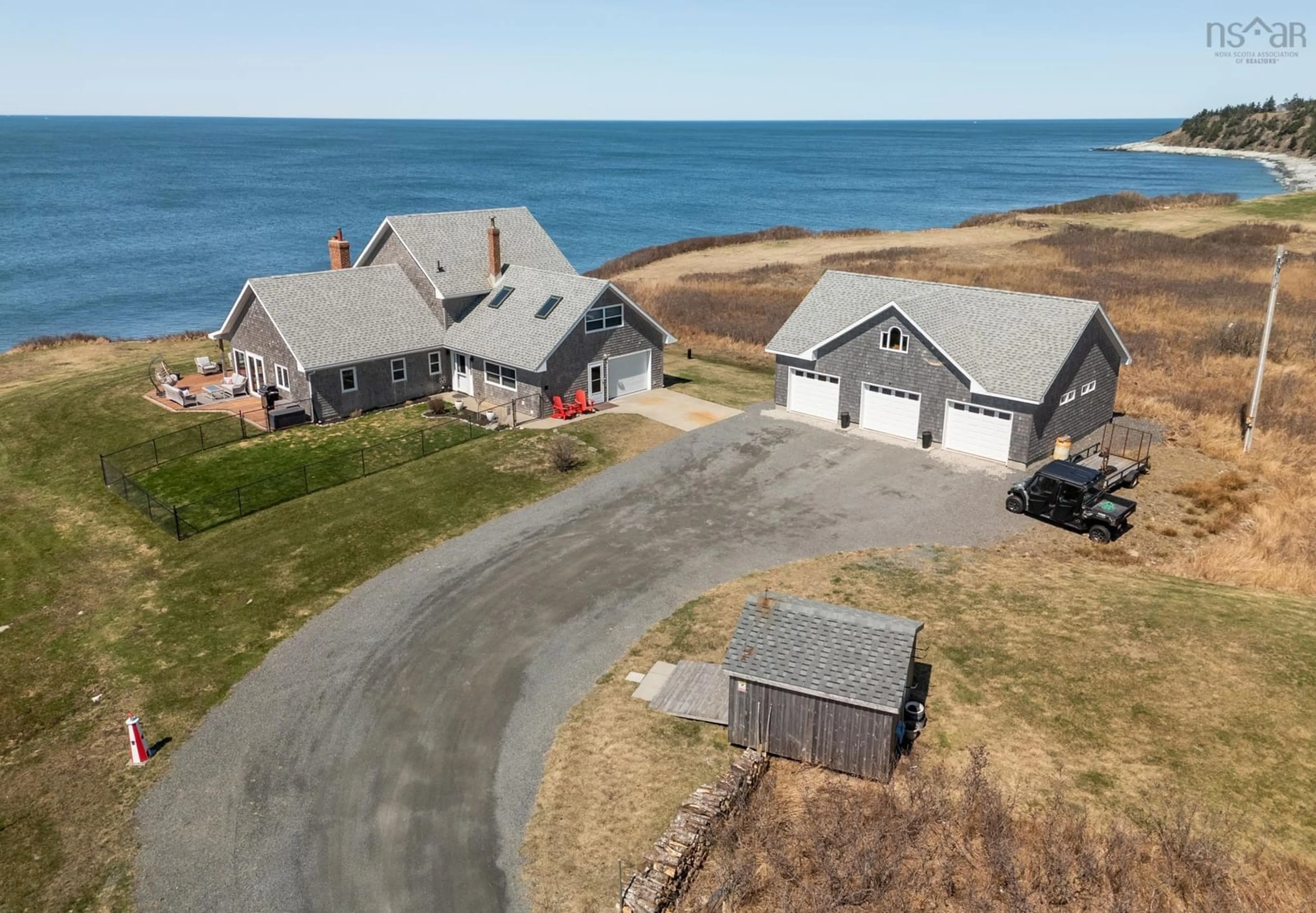 A pic from outside/outdoor area/front of a property/back of a property/a pic from drone, water/lake/river/ocean view for 2435 Main Shore Rd, Port Maitland Nova Scotia B5A 5V1