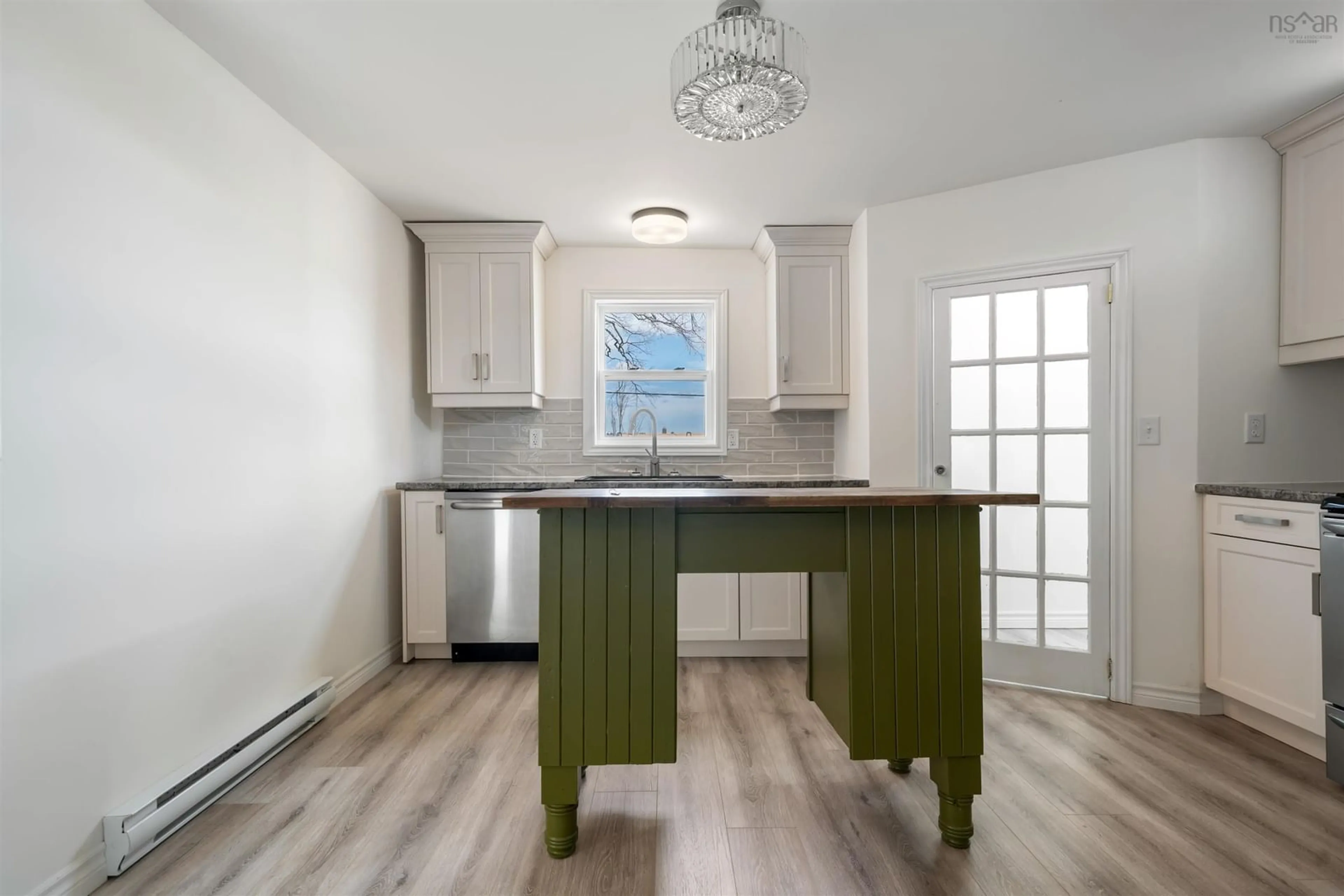 Open concept kitchen, wood/laminate floor for Athol Rd #2482, Springhill Nova Scotia B0M 1X0