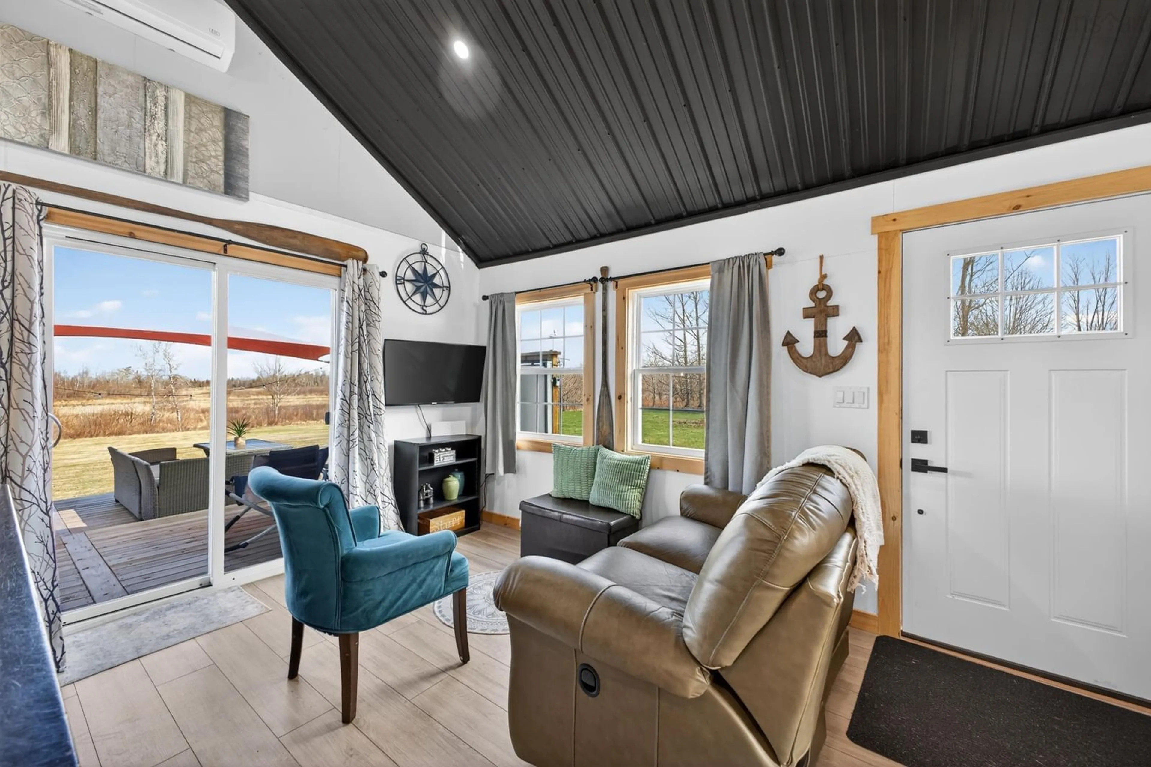 Living room with furniture, wood/laminate floor for 913 Upper River John Rd, Middleton Nova Scotia B0K 1V0