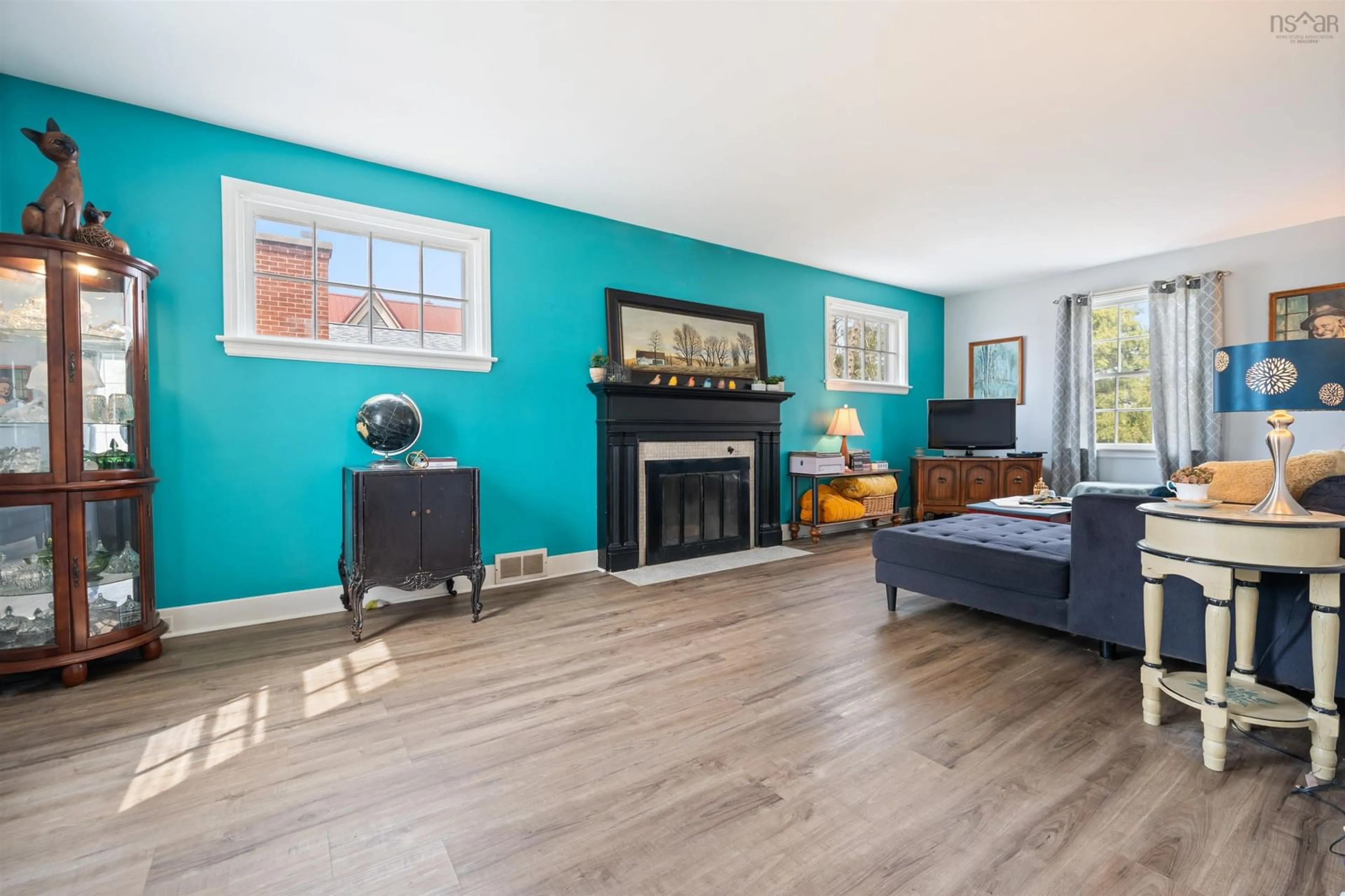 Living room with furniture, wood/laminate floor for 105 Lyman St, Truro Nova Scotia B2N 4S3