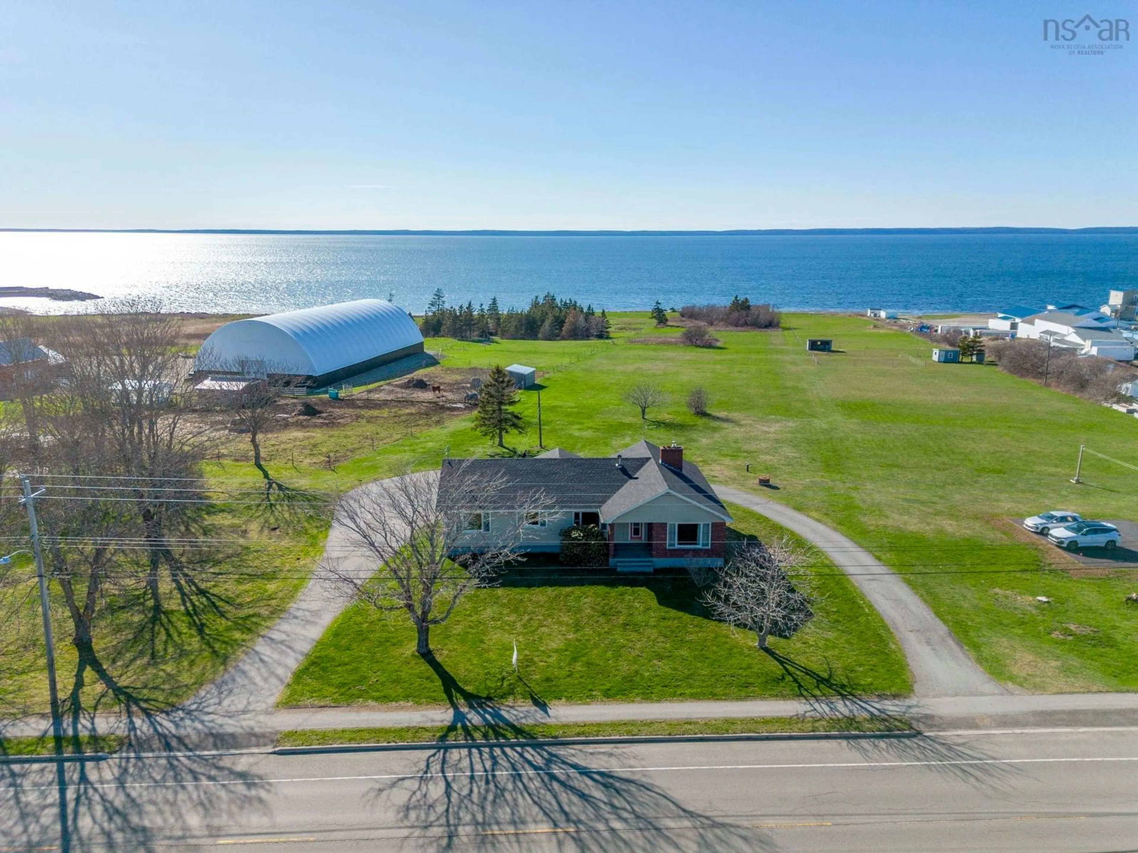A pic from outside/outdoor area/front of a property/back of a property/a pic from drone, water/lake/river/ocean view for 777 1 Hwy, Comeauville Nova Scotia B0W 2Z0