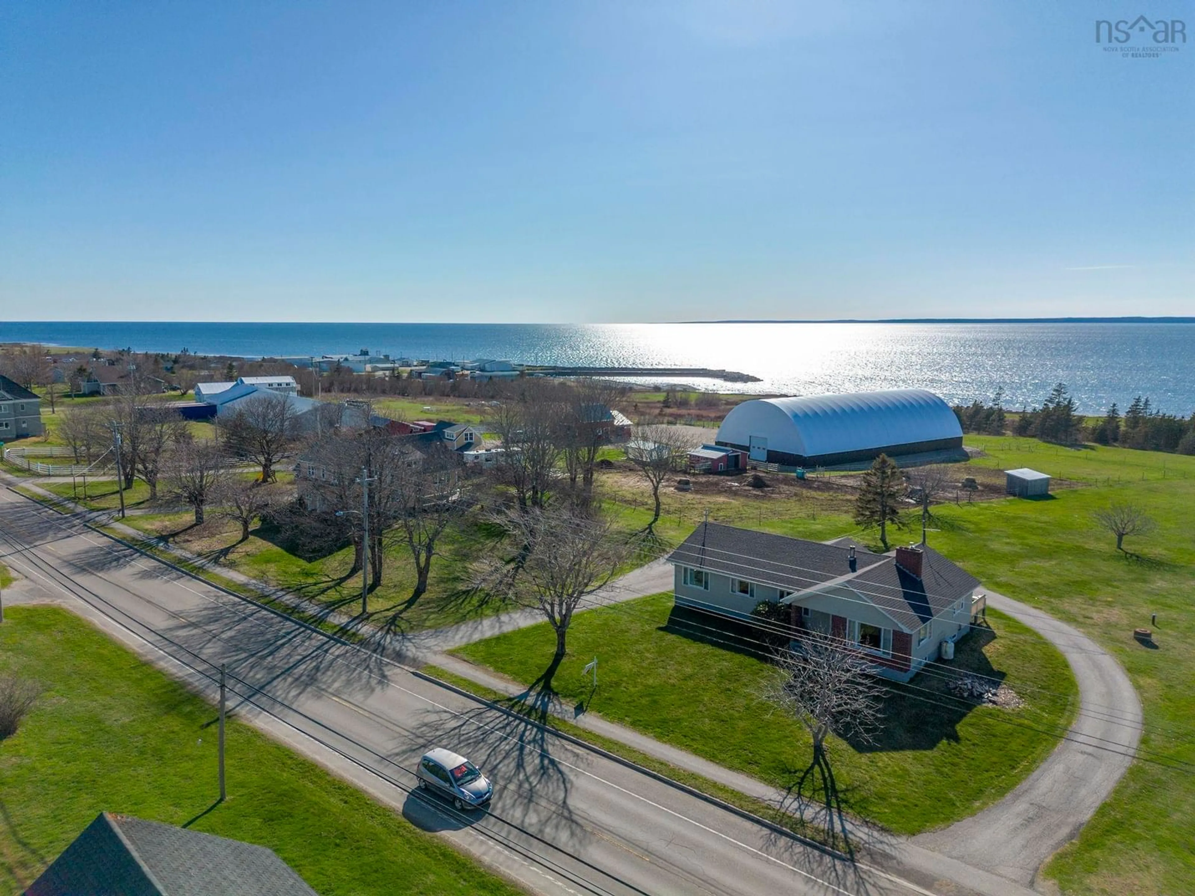 A pic from outside/outdoor area/front of a property/back of a property/a pic from drone, water/lake/river/ocean view for 777 1 Hwy, Comeauville Nova Scotia B0W 2Z0