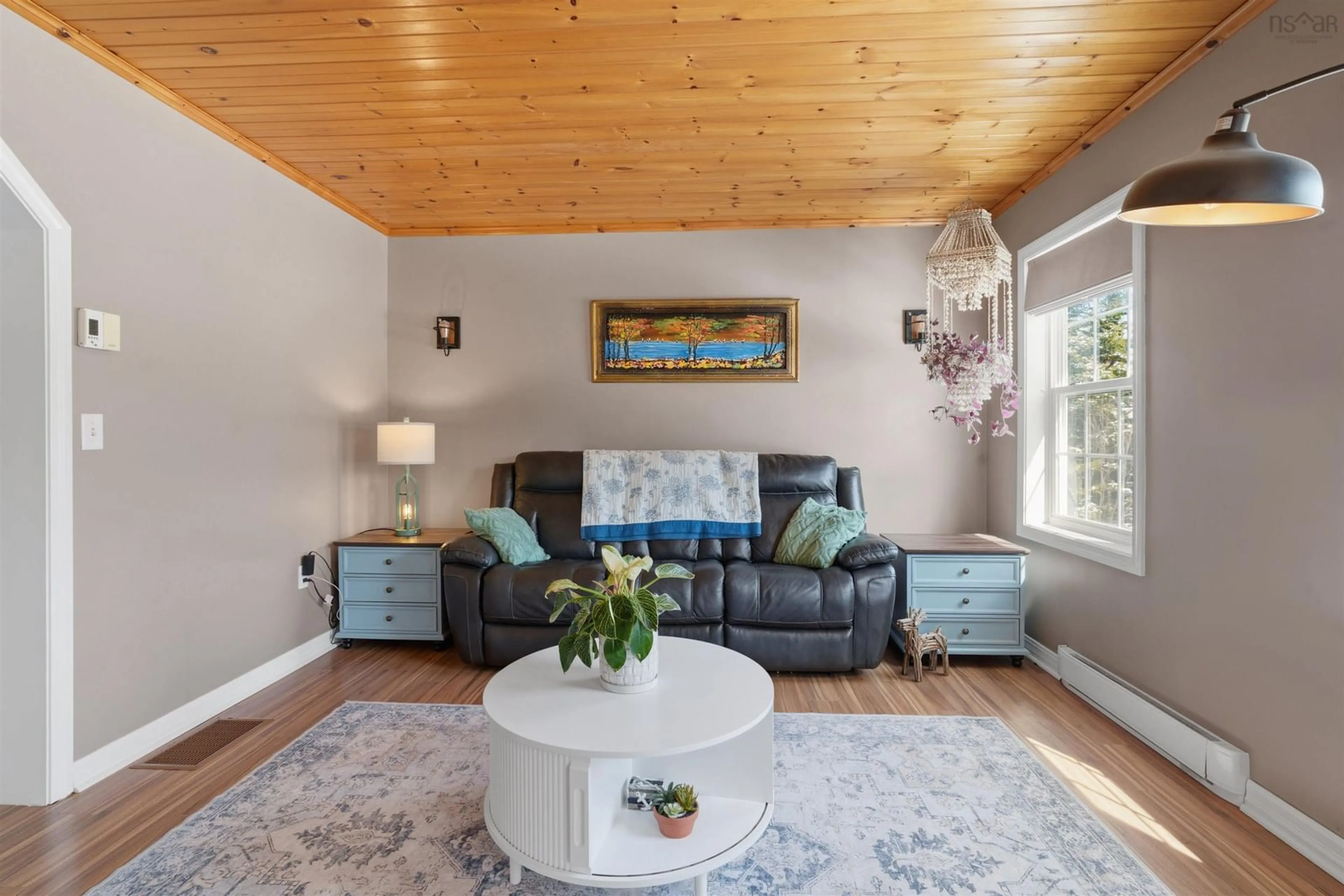 Living room with furniture, wood/laminate floor for 5 Osoogoone Lane, Clam Bay Nova Scotia B0J 2L0