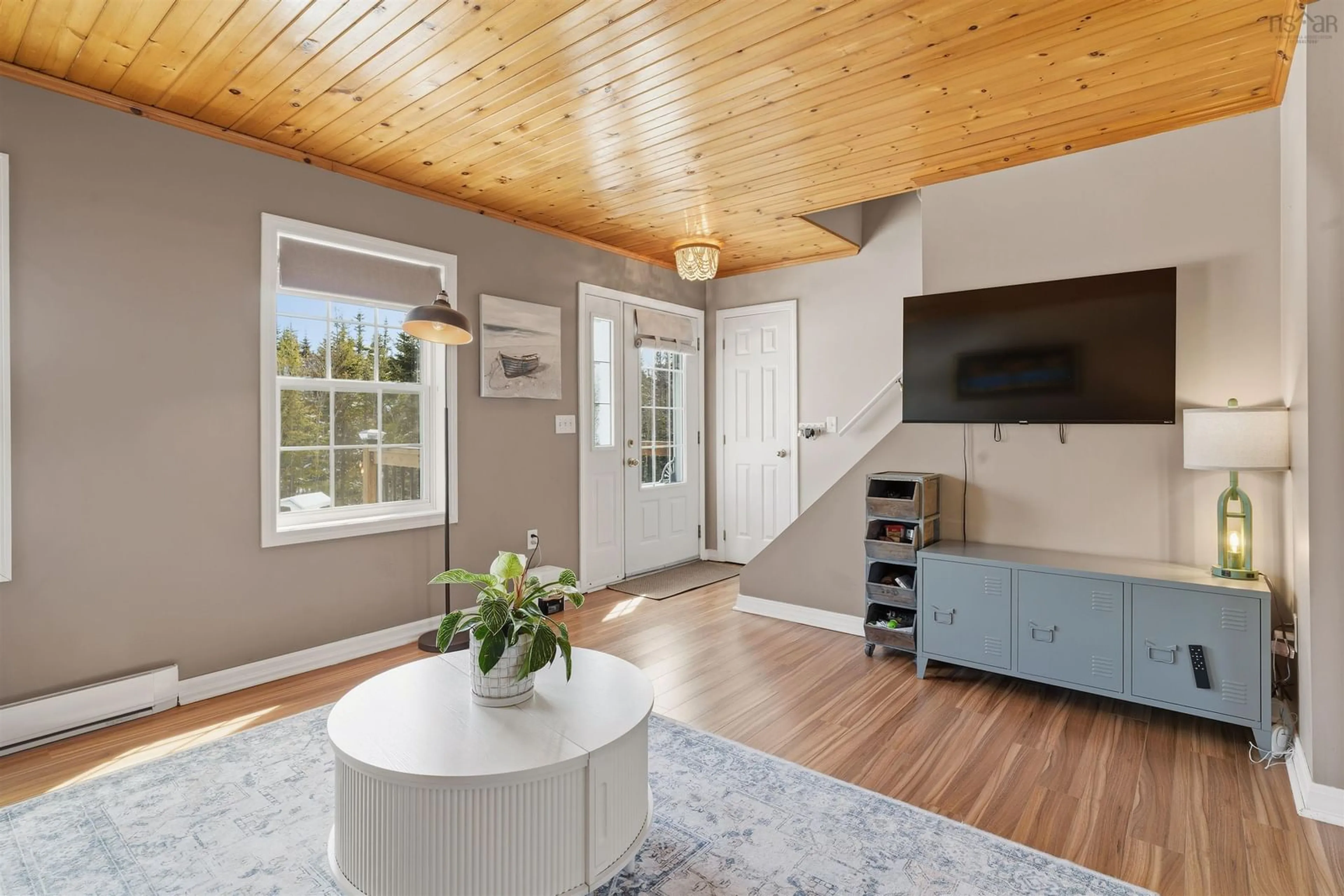Living room with furniture, wood/laminate floor for 5 Osoogoone Lane, Clam Bay Nova Scotia B0J 2L0