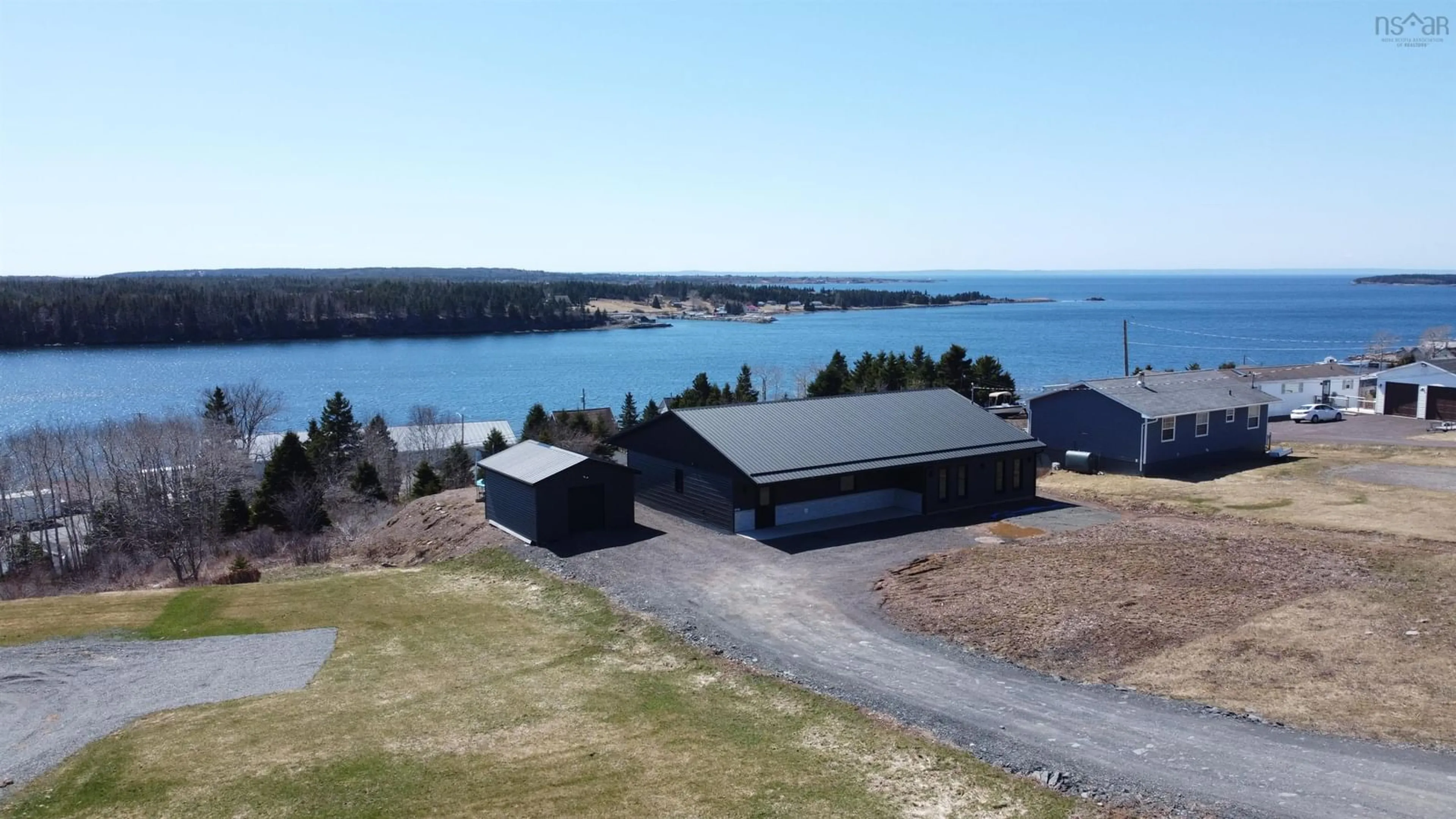 A pic from outside/outdoor area/front of a property/back of a property/a pic from drone, water/lake/river/ocean view for 2712 High Road Rd, Arichat Nova Scotia B0E 1A0