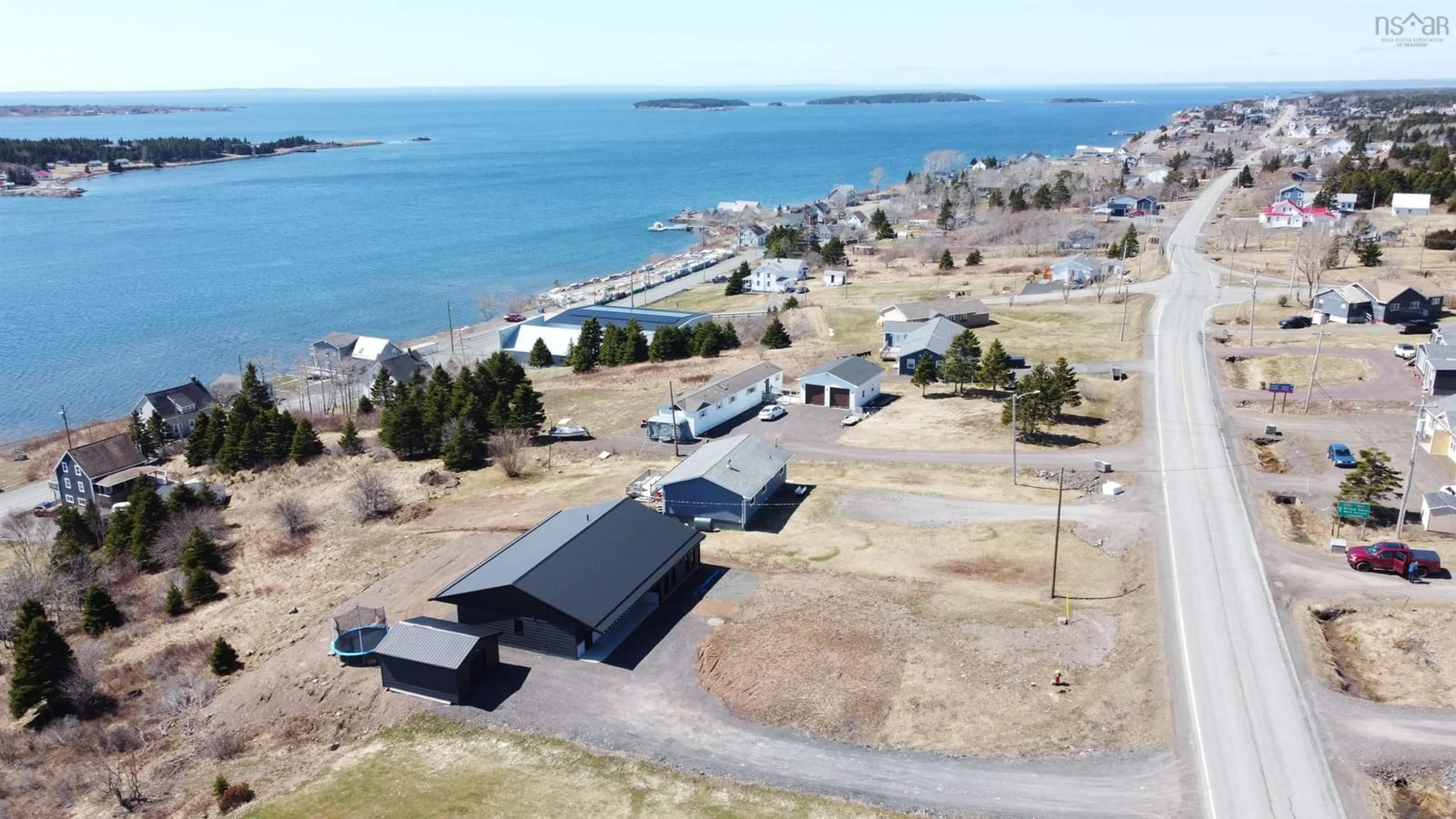 A pic from outside/outdoor area/front of a property/back of a property/a pic from drone, water/lake/river/ocean view for 2712 High Road Rd, Arichat Nova Scotia B0E 1A0