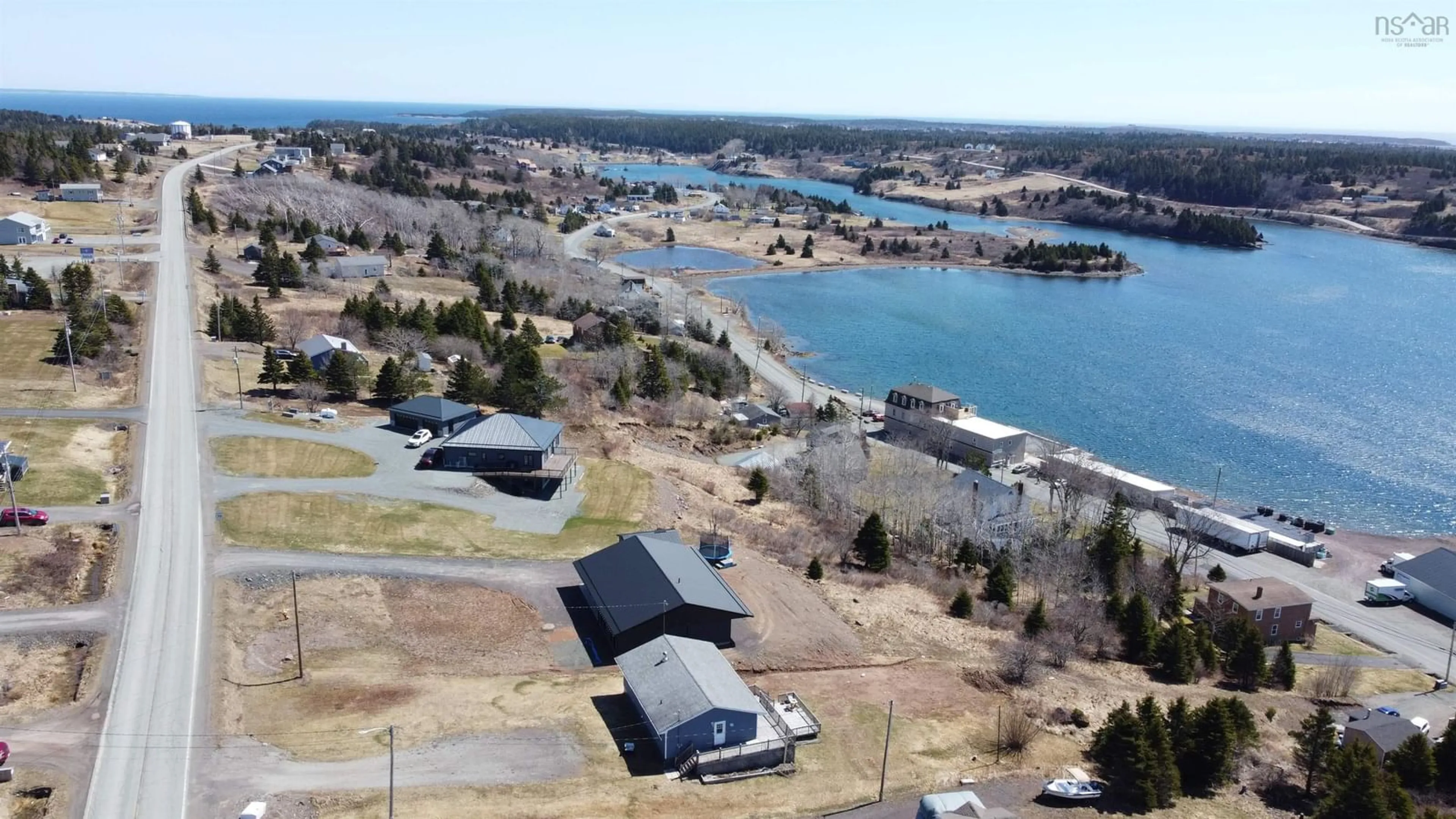 A pic from outside/outdoor area/front of a property/back of a property/a pic from drone, water/lake/river/ocean view for 2712 High Road Rd, Arichat Nova Scotia B0E 1A0