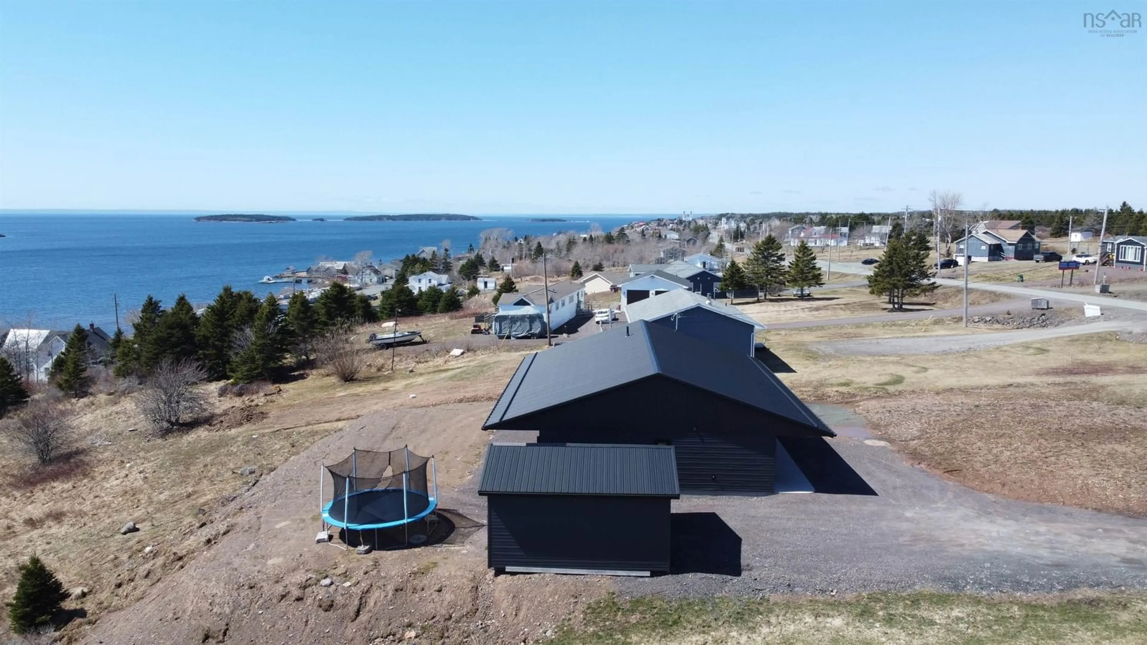 A pic from outside/outdoor area/front of a property/back of a property/a pic from drone, water/lake/river/ocean view for 2712 High Road Rd, Arichat Nova Scotia B0E 1A0