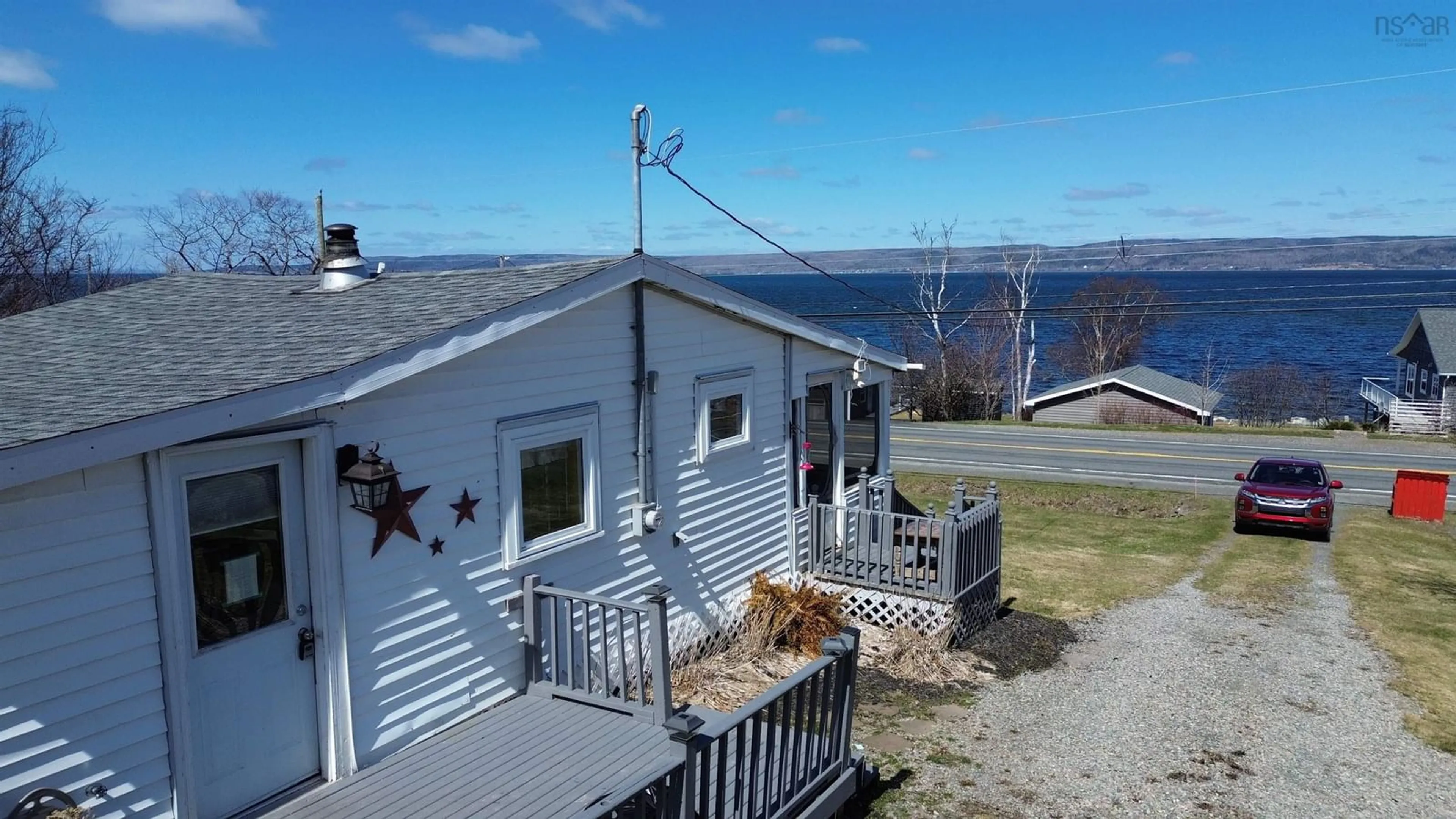 A pic from outside/outdoor area/front of a property/back of a property/a pic from drone, water/lake/river/ocean view for 7403 East Bay Highway, Big Pond Nova Scotia B1J 1Y1