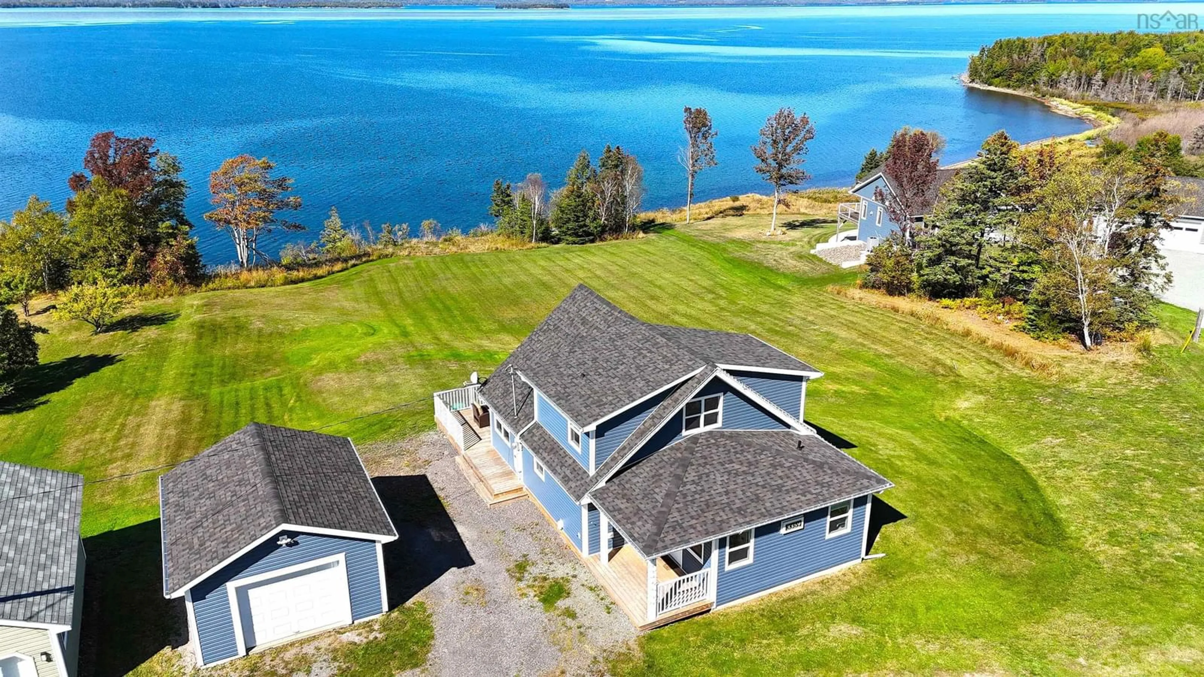 A pic from outside/outdoor area/front of a property/back of a property/a pic from drone, water/lake/river/ocean view for 3359 West Bay Rd, St. Georges Channel Nova Scotia B0E 3K0