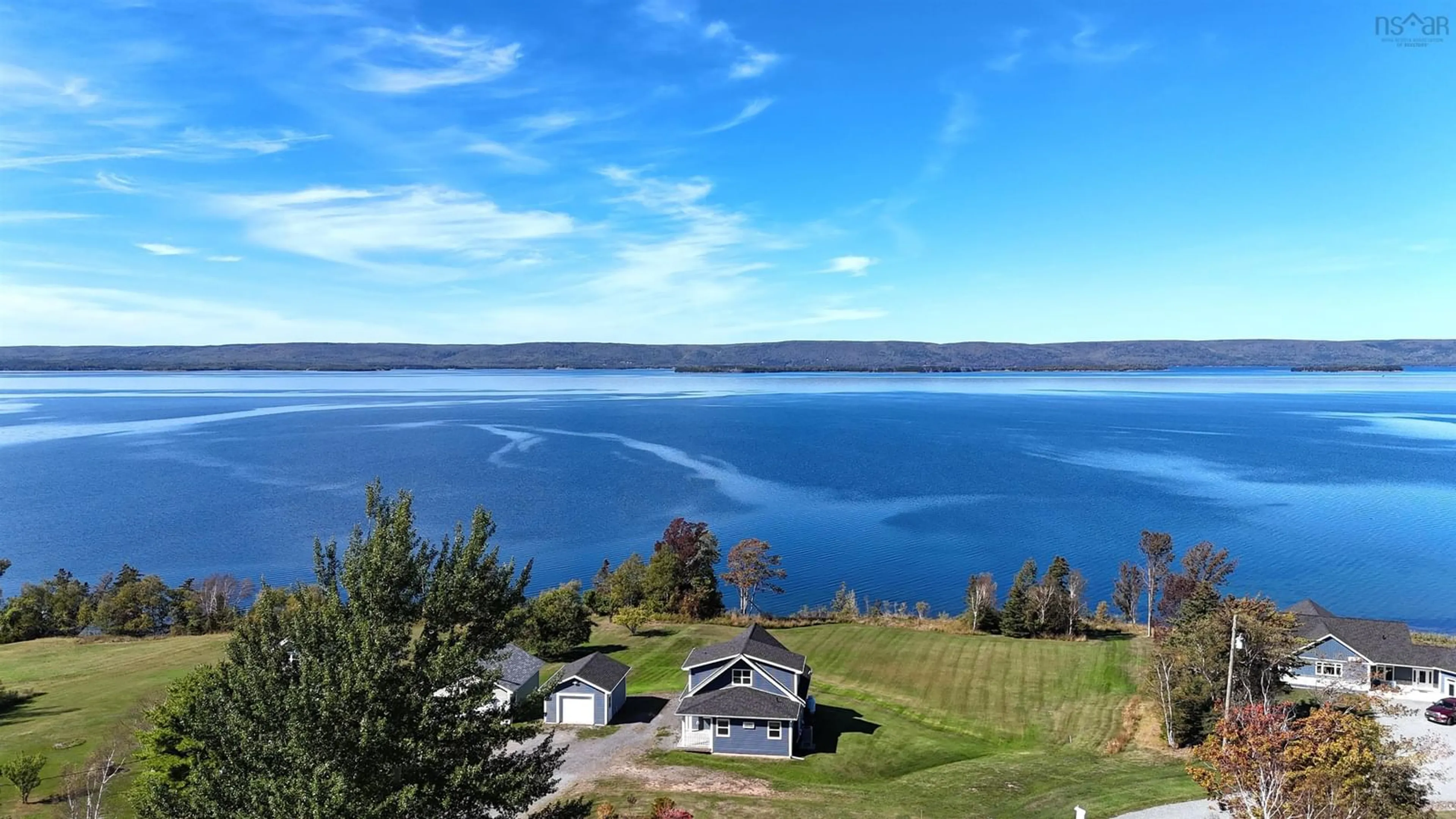 A pic from outside/outdoor area/front of a property/back of a property/a pic from drone, water/lake/river/ocean view for 3359 West Bay Rd, St. Georges Channel Nova Scotia B0E 3K0