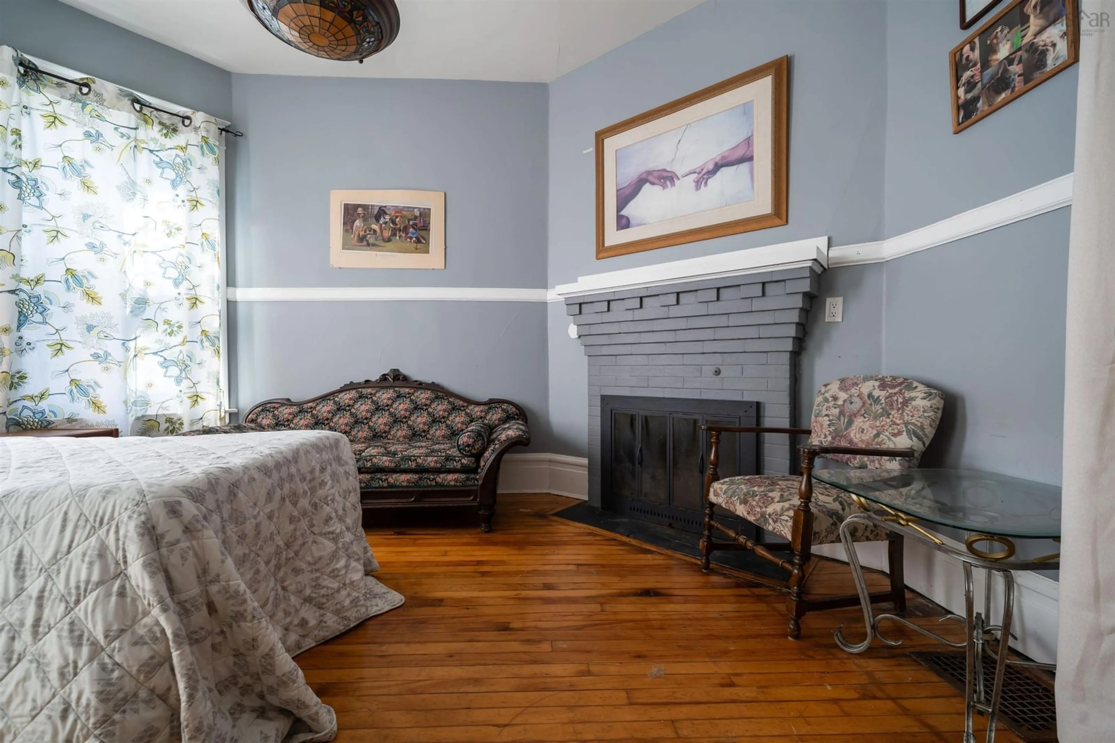 Living room with furniture, wood/laminate floor for 40 Clifford St, Amherst Nova Scotia B4H 2G4