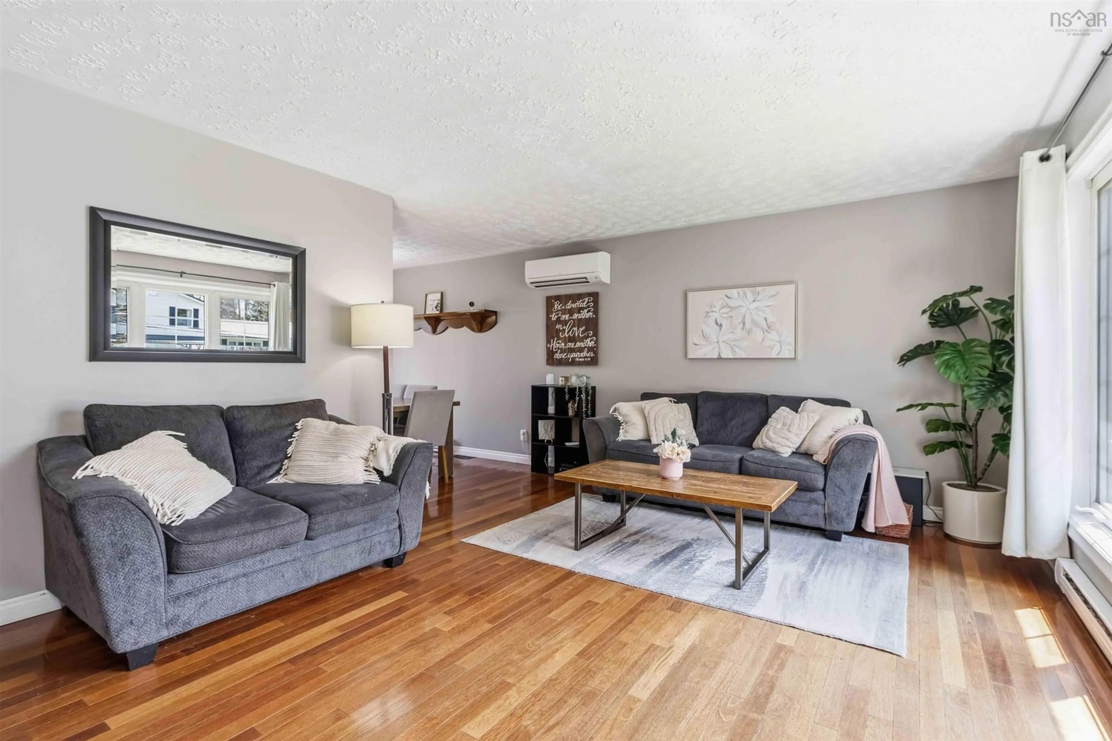 Living room with furniture, wood/laminate floor for 63 Desbrisay Dr, Bridgewater Nova Scotia B4V 3E3