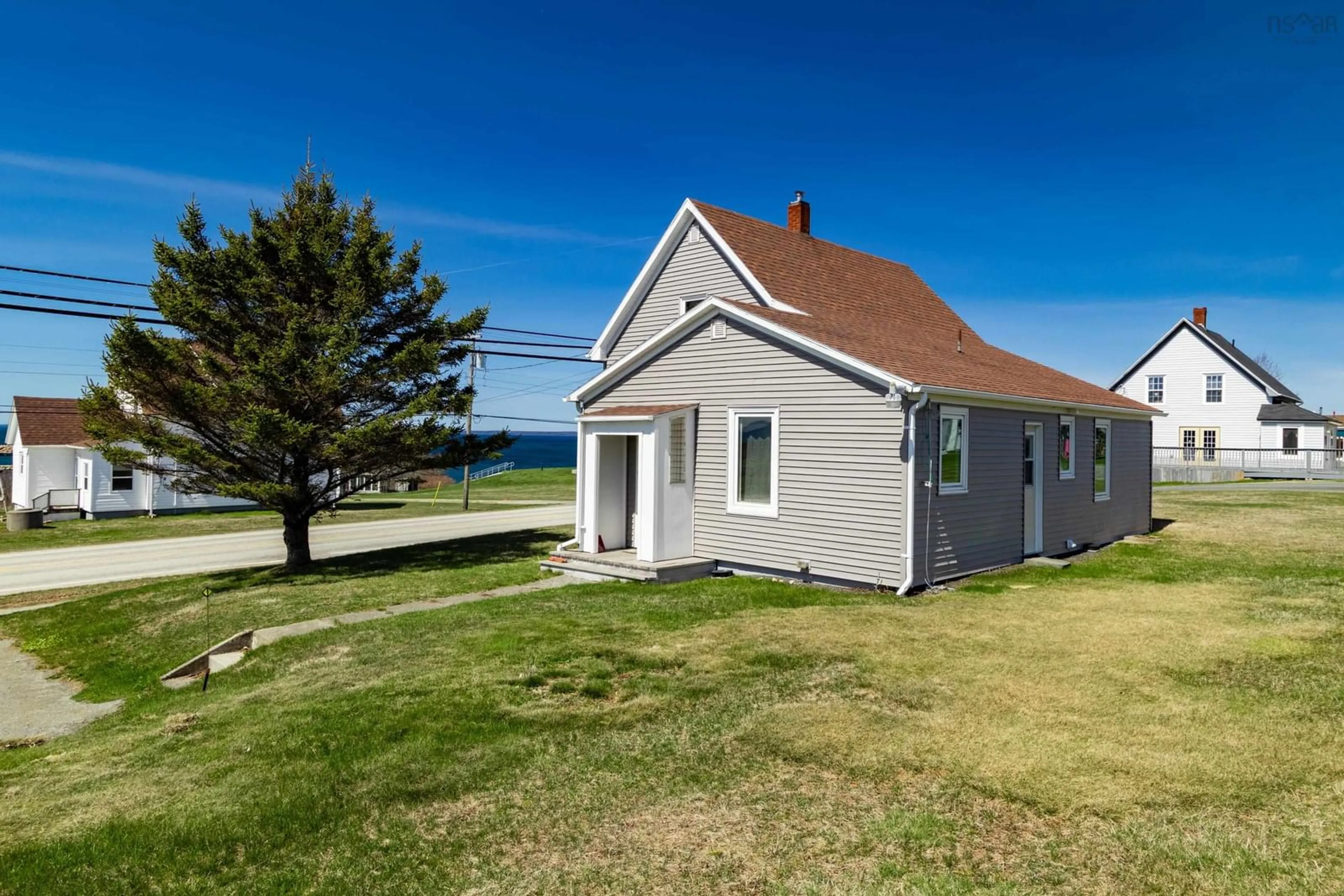 A pic from outside/outdoor area/front of a property/back of a property/a pic from drone, water/lake/river/ocean view for 10130 Highway 1, Saulnierville Nova Scotia B0W 2Z0