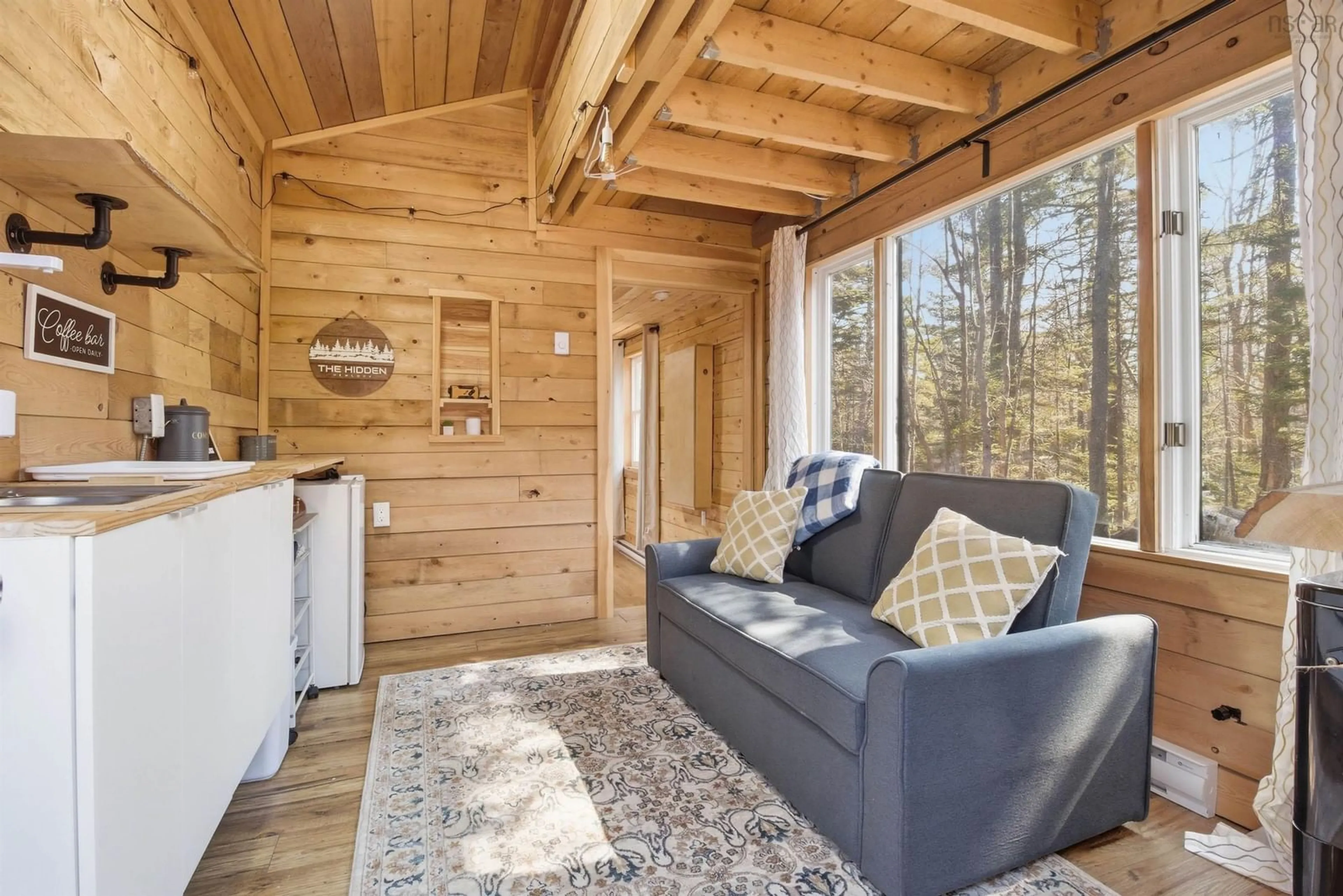 Living room with furniture, wood/laminate floor for 278 Forest Dr, Hemford Nova Scotia B0R 1A0