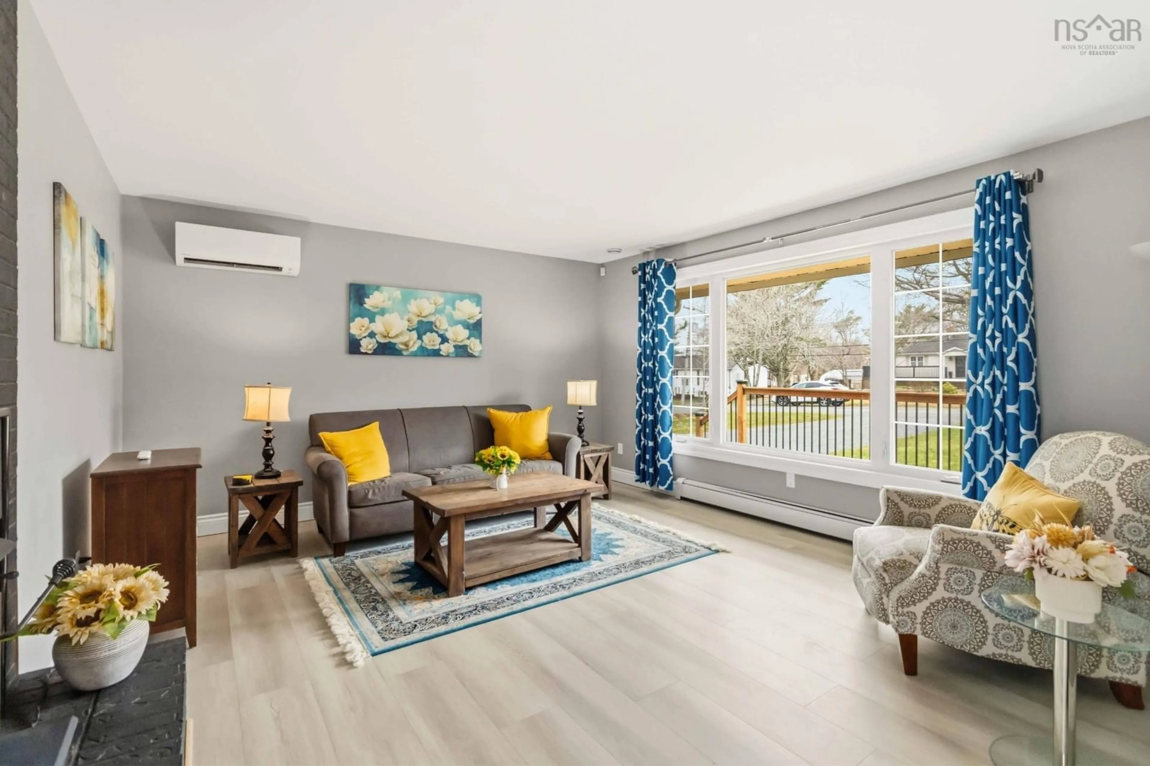 Living room with furniture, wood/laminate floor for 29 Lively Rd, Middle Sackville Nova Scotia B4E 3A9
