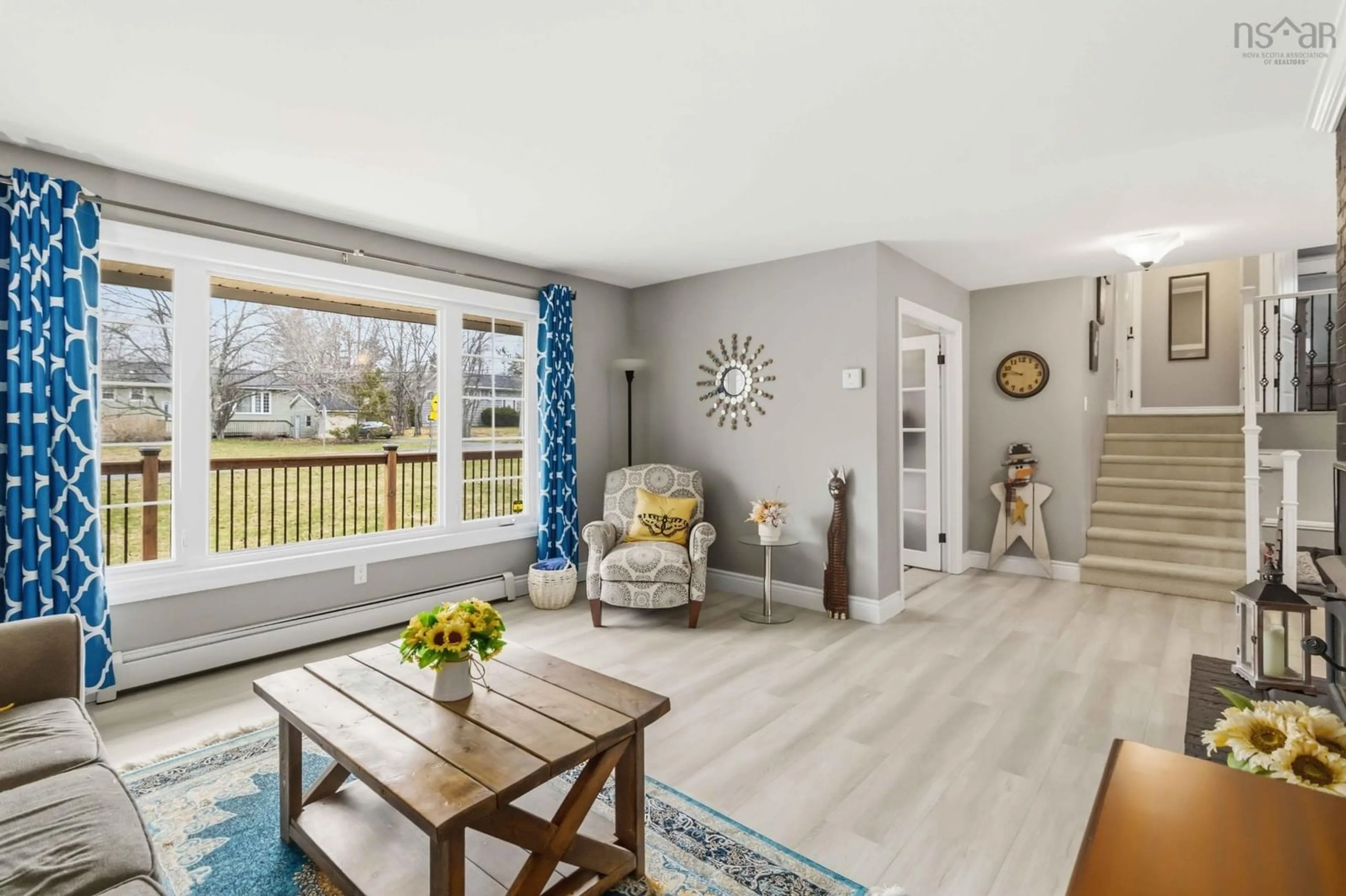 Living room with furniture, wood/laminate floor for 29 Lively Rd, Middle Sackville Nova Scotia B4E 3A9