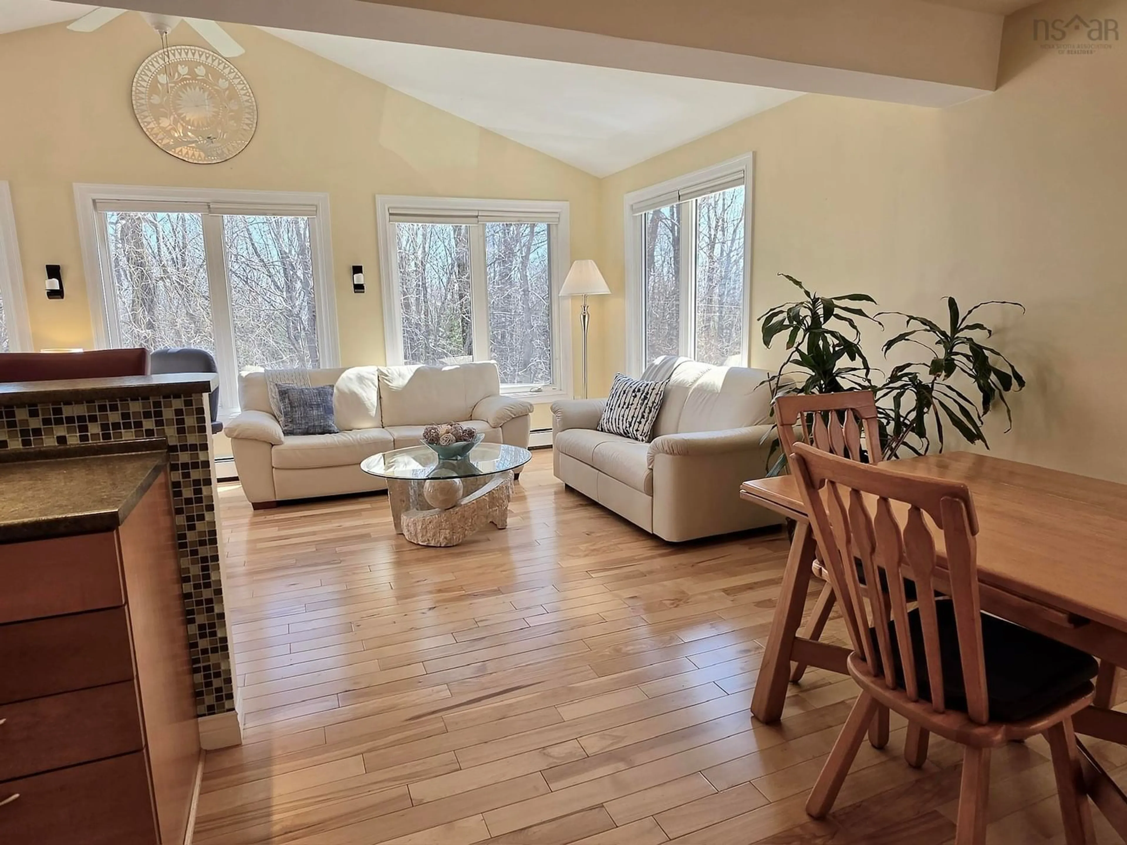 Living room with furniture, wood/laminate floor for 3 Beech St, Bedford Nova Scotia B4A 1T1