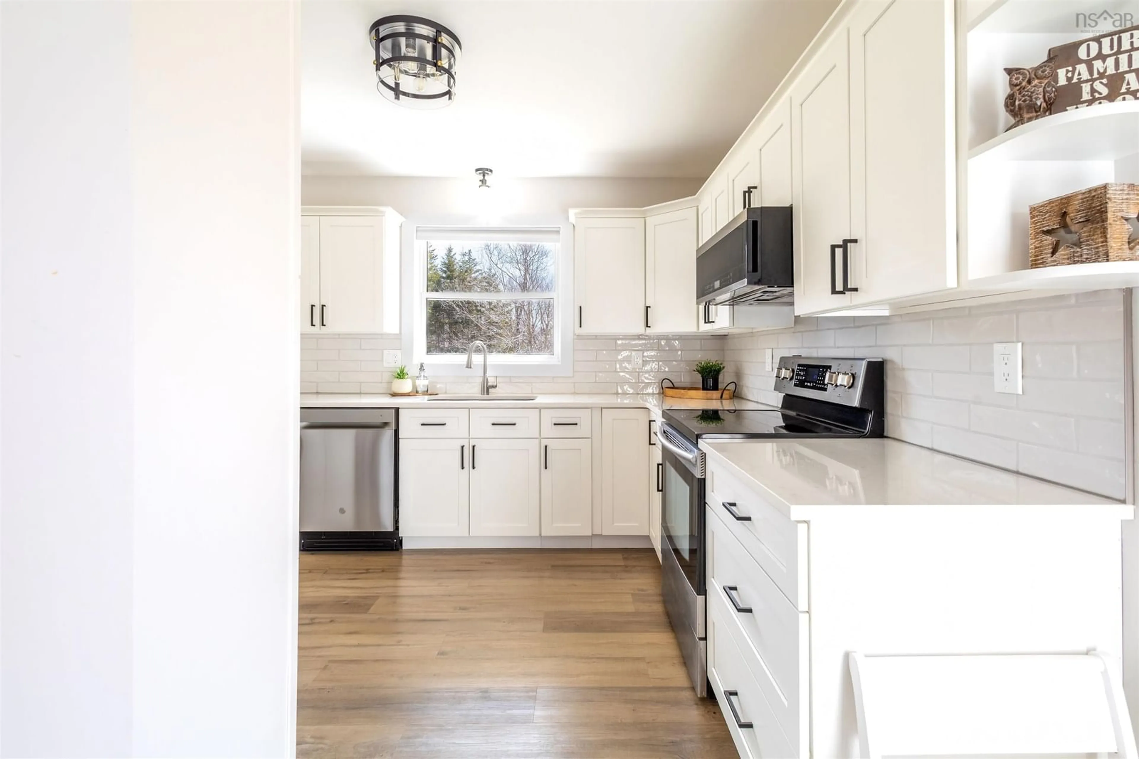 Open concept kitchen, wood/laminate floor for 299 Hills Rd, Albert Bridge Nova Scotia B1K 3E4