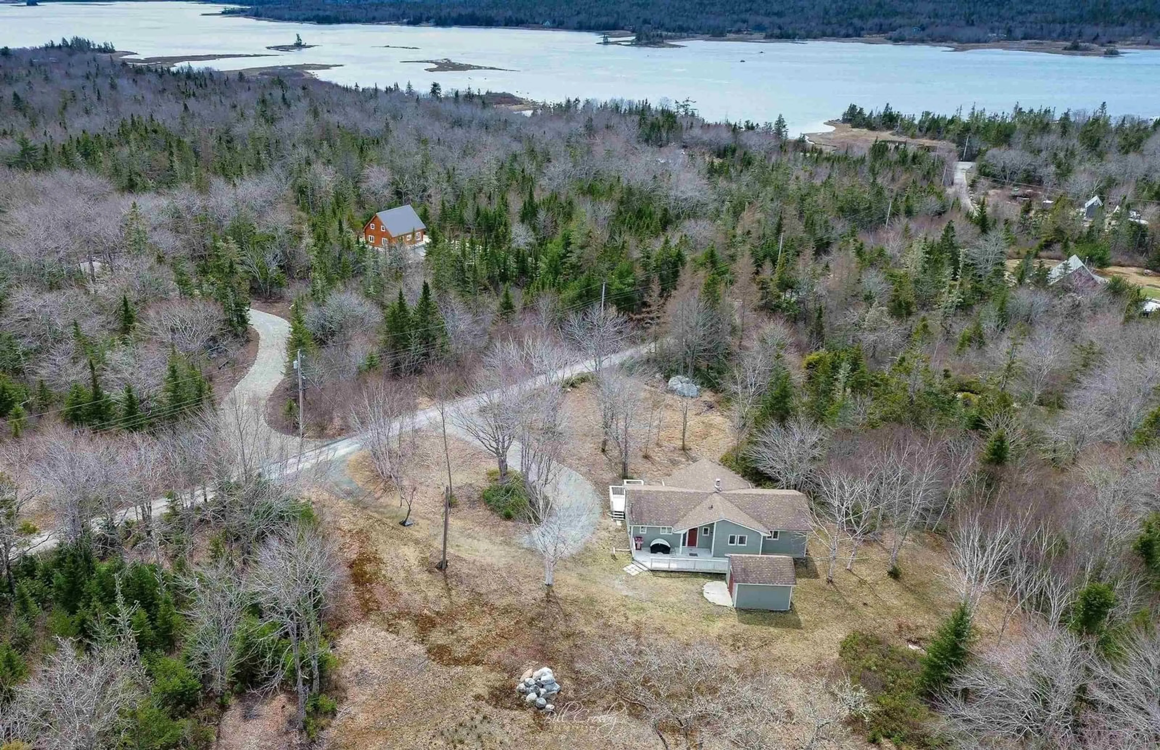 A pic from outside/outdoor area/front of a property/back of a property/a pic from drone, water/lake/river/ocean view for 57 Somerset Dr, East Sable River Nova Scotia B0T 1V0