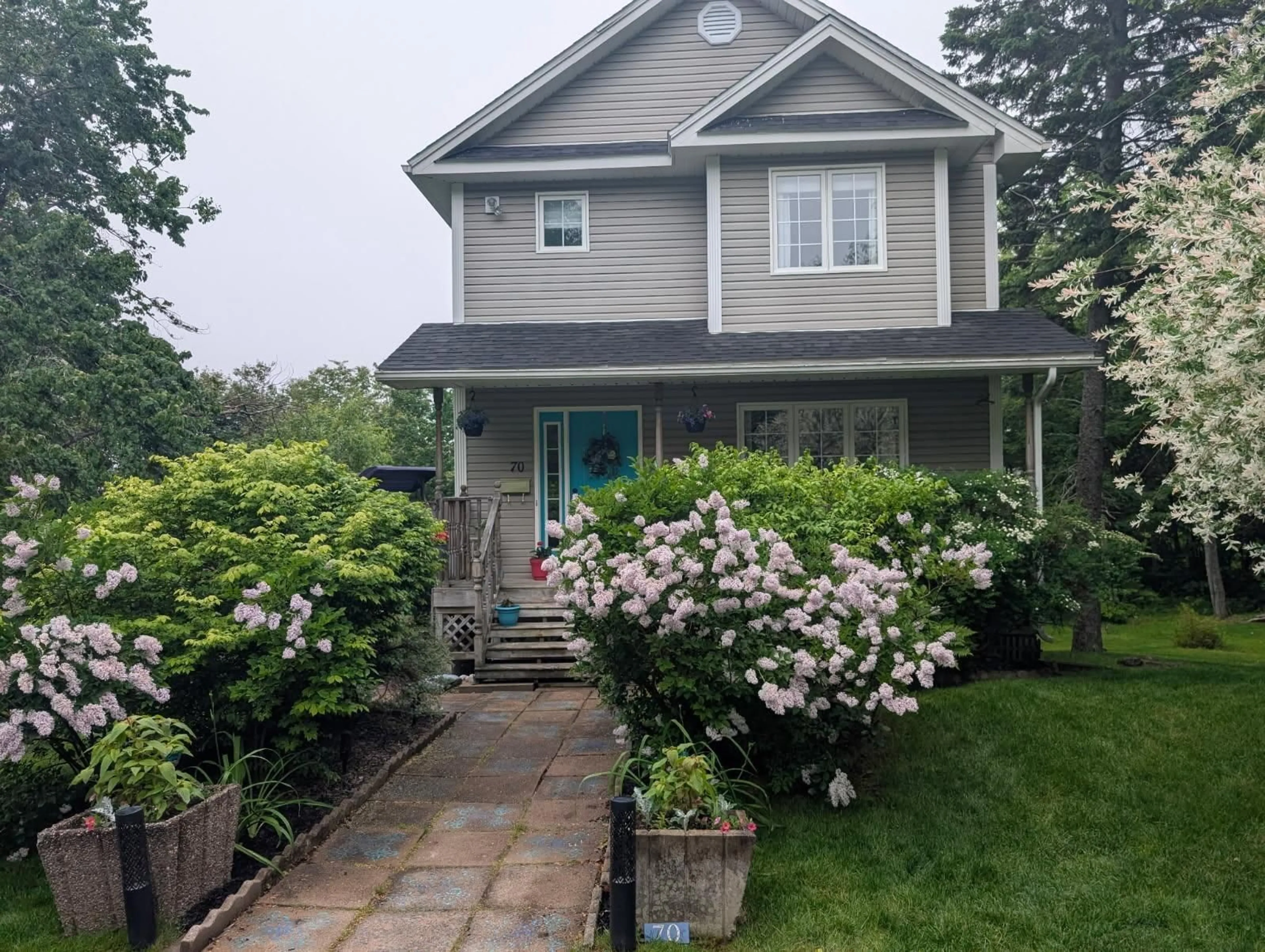 Home with vinyl exterior material, street for 70 Hillside Ave, Lower Sackville Nova Scotia B4C 1W7