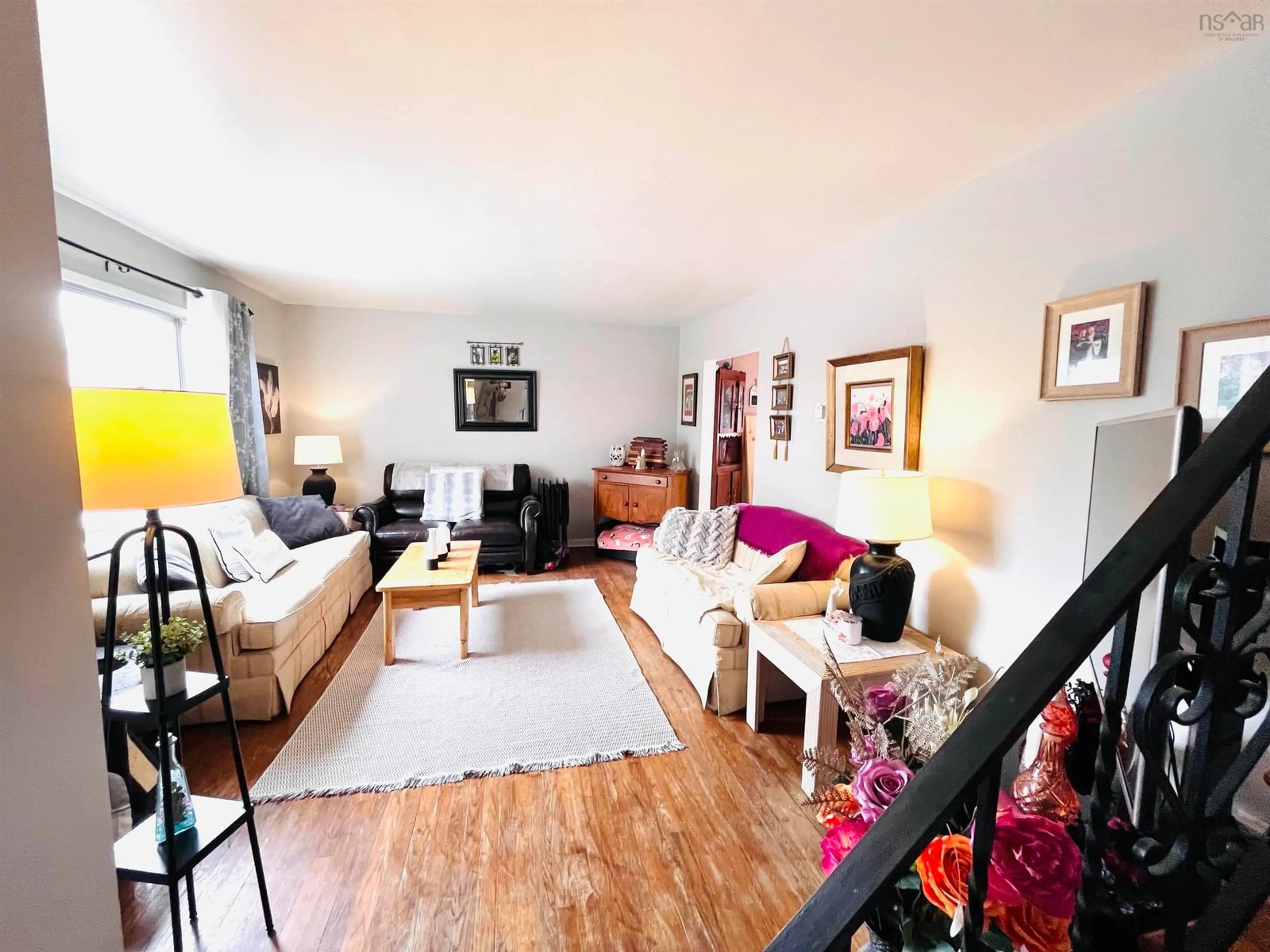 Living room with furniture, wood/laminate floor for 84 Williams Lake Rd #A B, Armdale Nova Scotia B3P 1T3