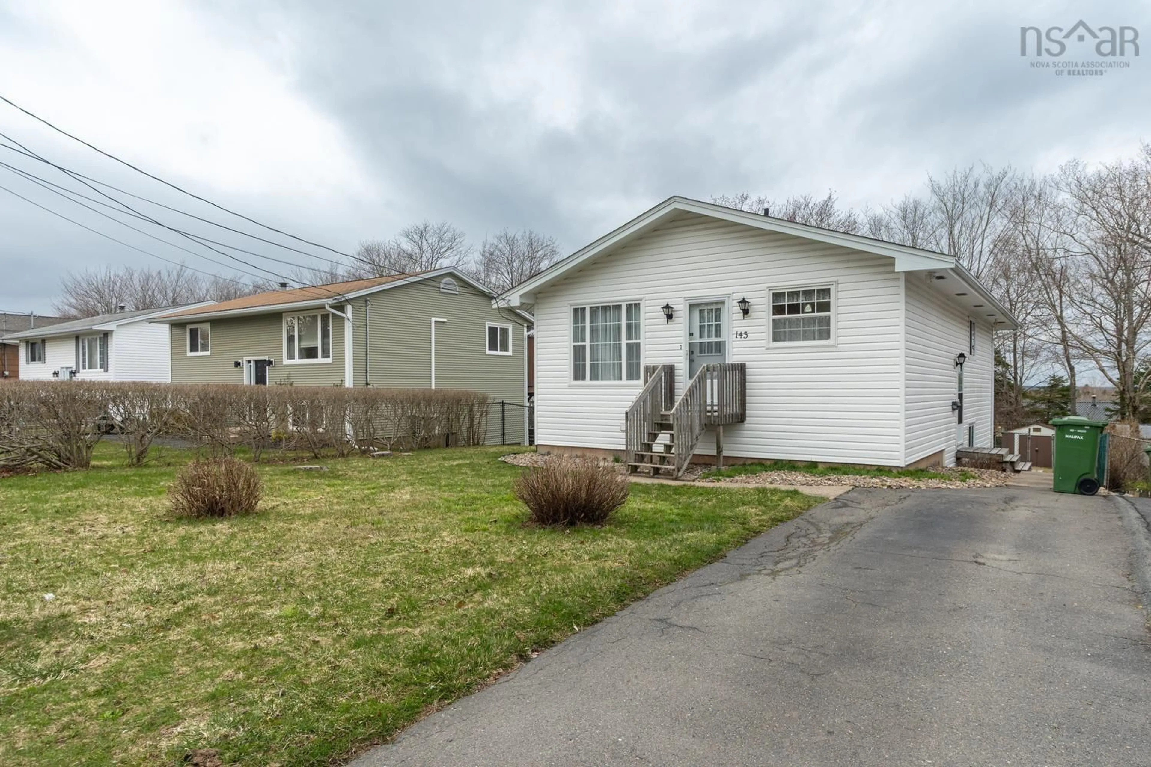 Home with vinyl exterior material, street for 145 Poplar Dr, Cole Harbour Nova Scotia B2W 2K7