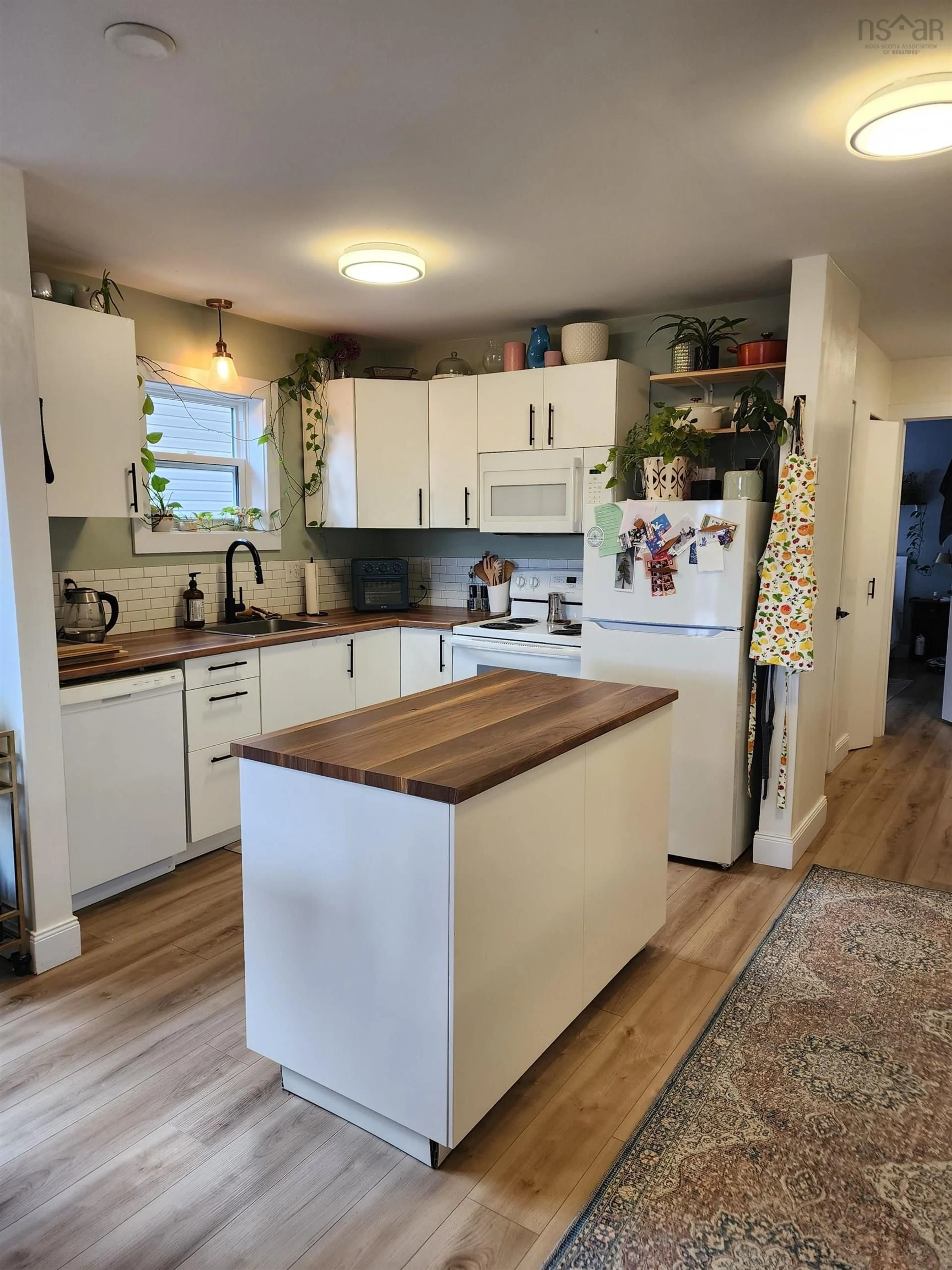 Open concept kitchen, wood/laminate floor for 389-393 Renfrew St #391, Halifax Nova Scotia B2Y 2M4