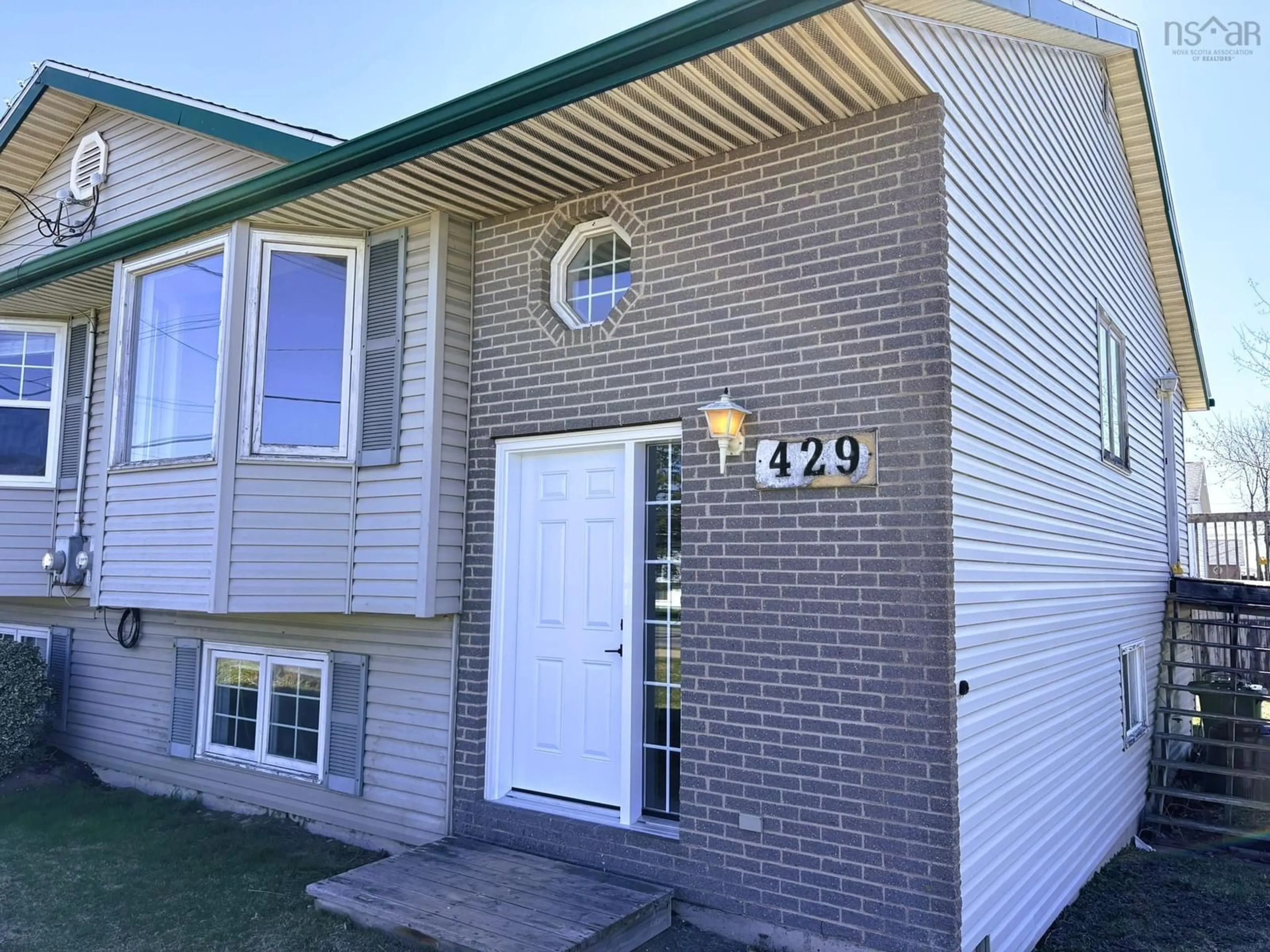 Home with vinyl exterior material, street for 429 Cow Bay Rd, Eastern Passage Nova Scotia B3G 1J4