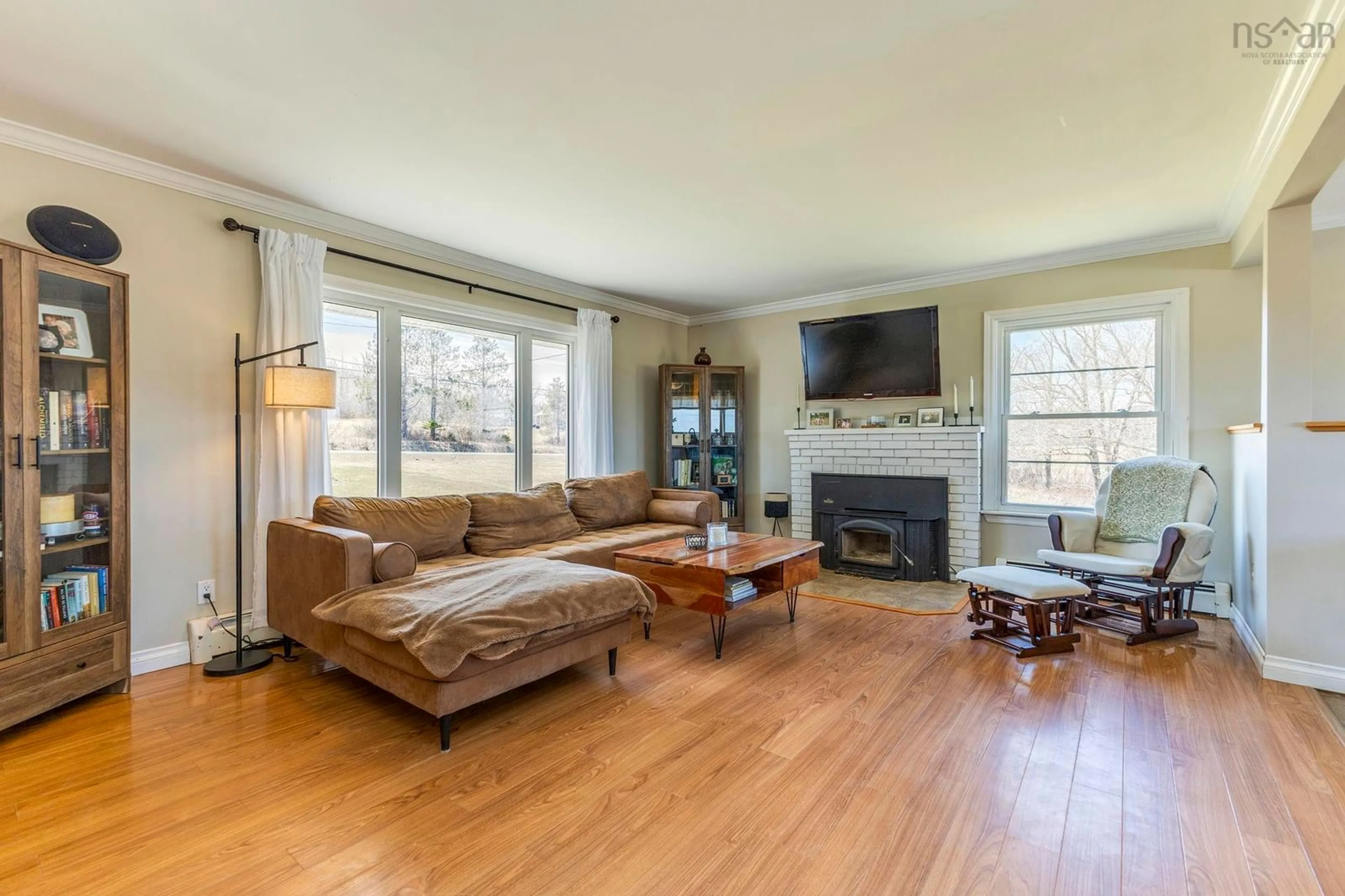 Living room with furniture, wood/laminate floor for 5851 Little Harbour Rd, Kings Head Nova Scotia B2H 5C4