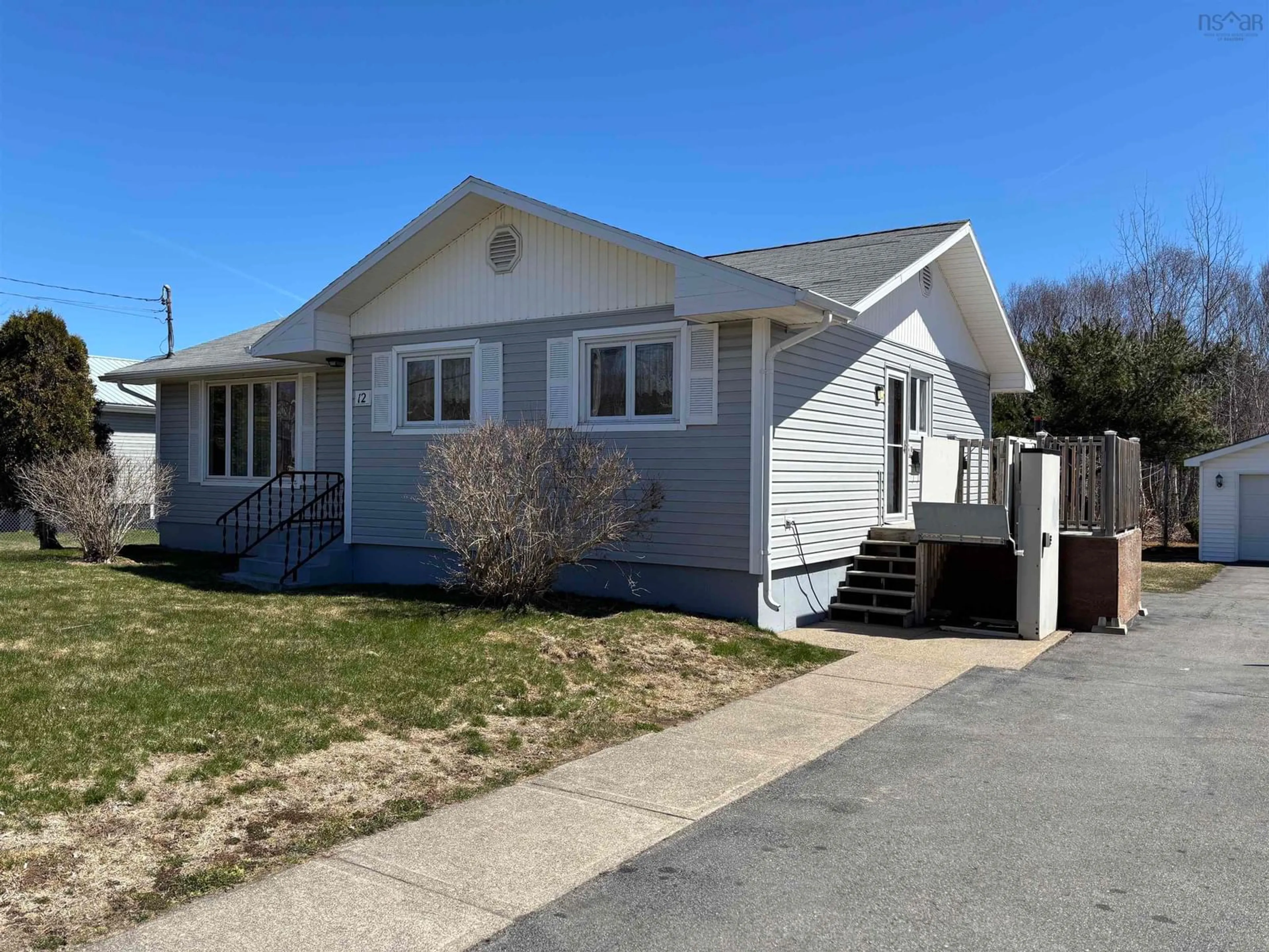 Home with vinyl exterior material, street for 12 Wilkie Avenue, North Sydney Nova Scotia B2A 1Y4
