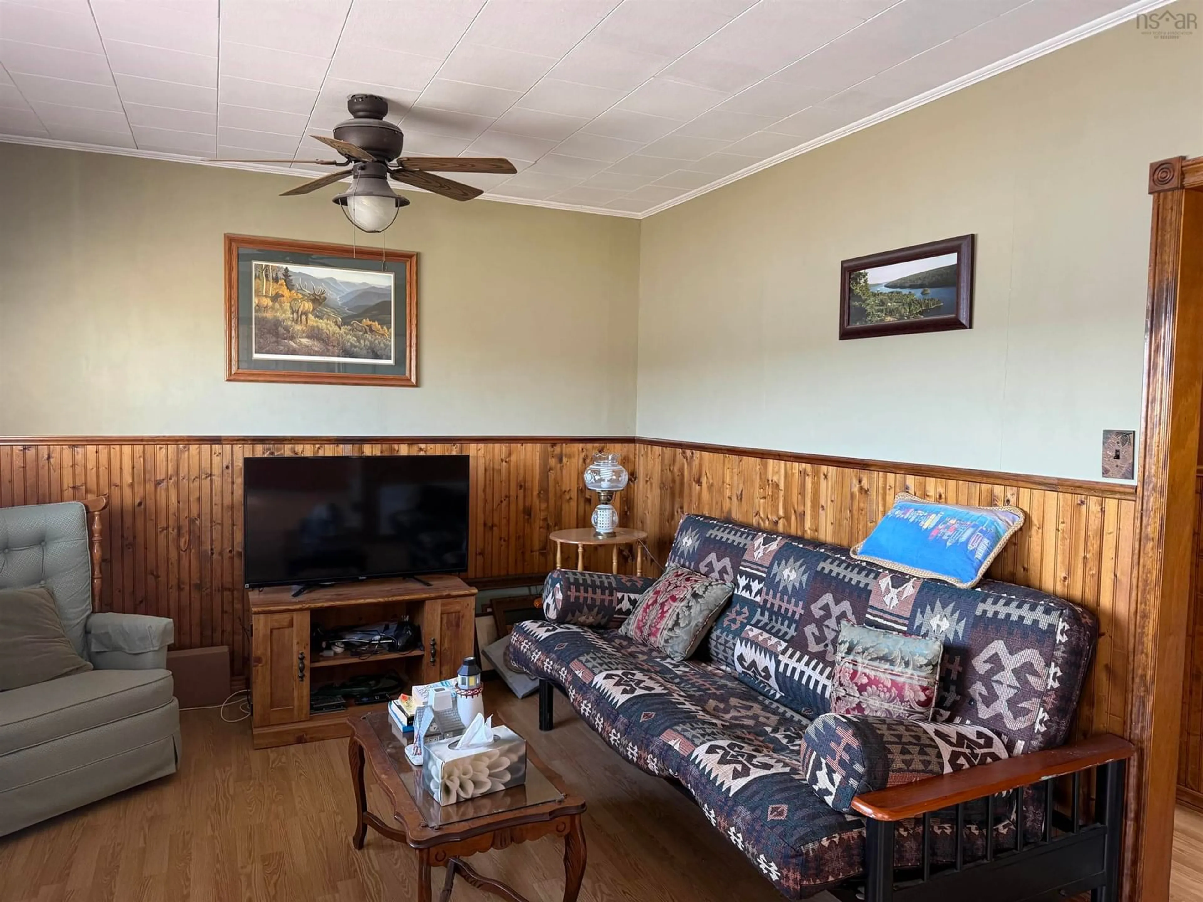 Living room with furniture, wood/laminate floor for 15576 Highway 316, Middle Country Harbour Nova Scotia B0K 1J0