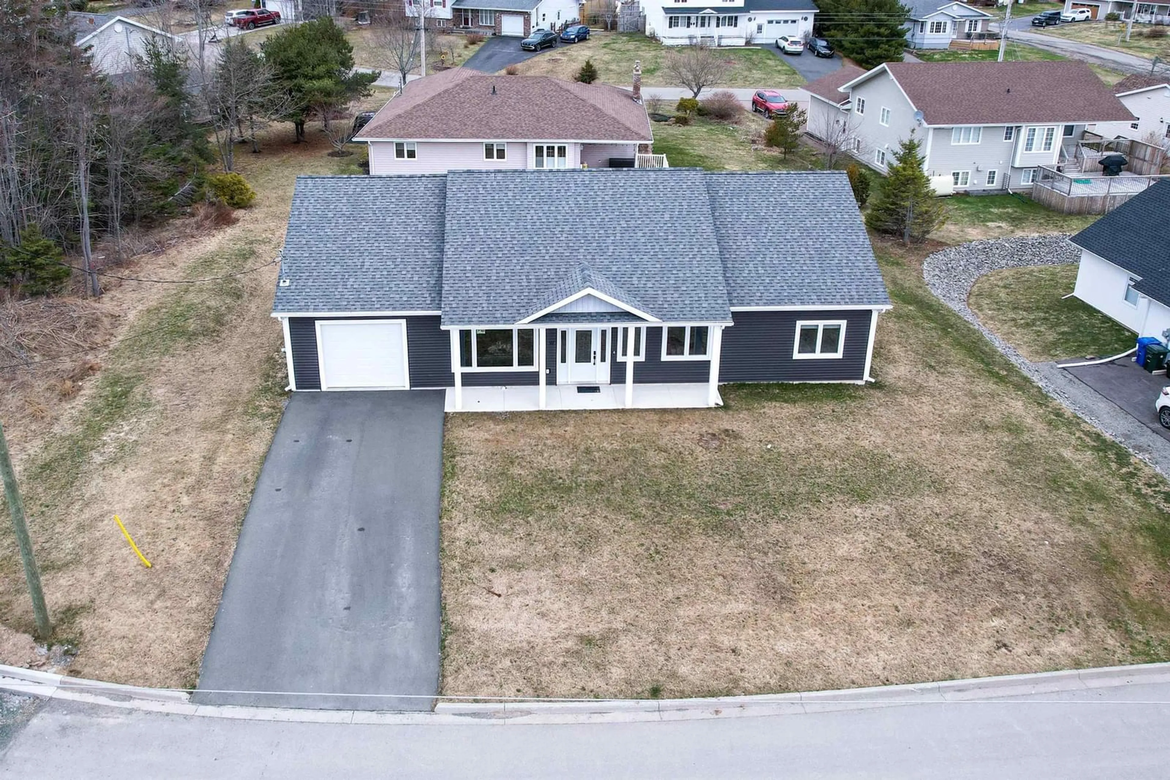 A pic from outside/outdoor area/front of a property/back of a property/a pic from drone, street for 91 Ridgevale Dr, Westmount Nova Scotia B1R 0C2