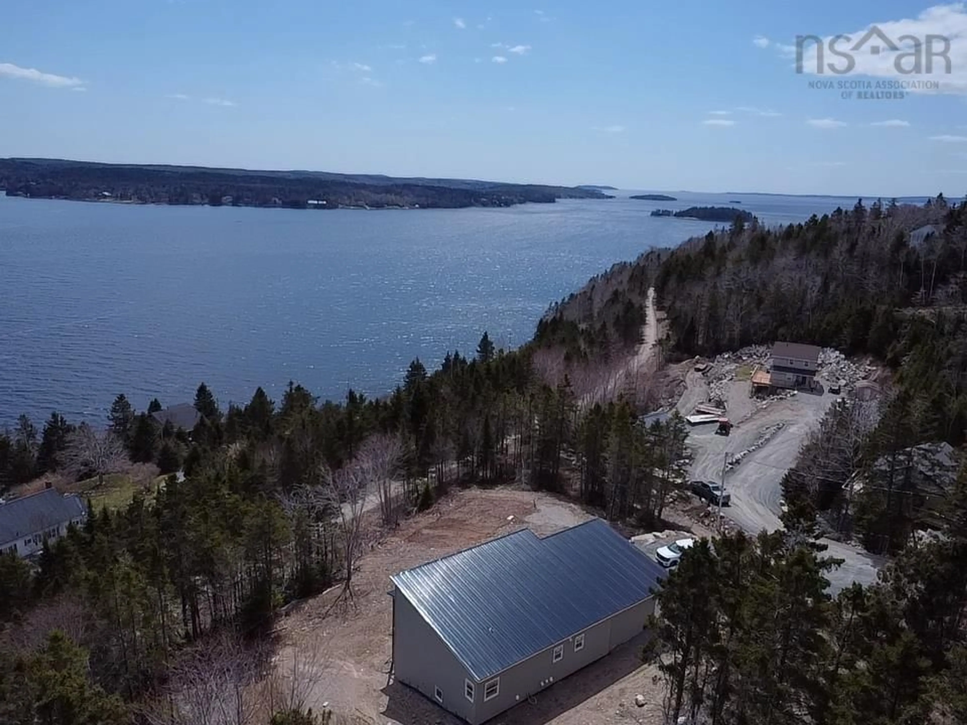 A pic from outside/outdoor area/front of a property/back of a property/a pic from drone, water/lake/river/ocean view for 28 Marinavista Lane, Boutiliers Point Nova Scotia B3Z 0W9