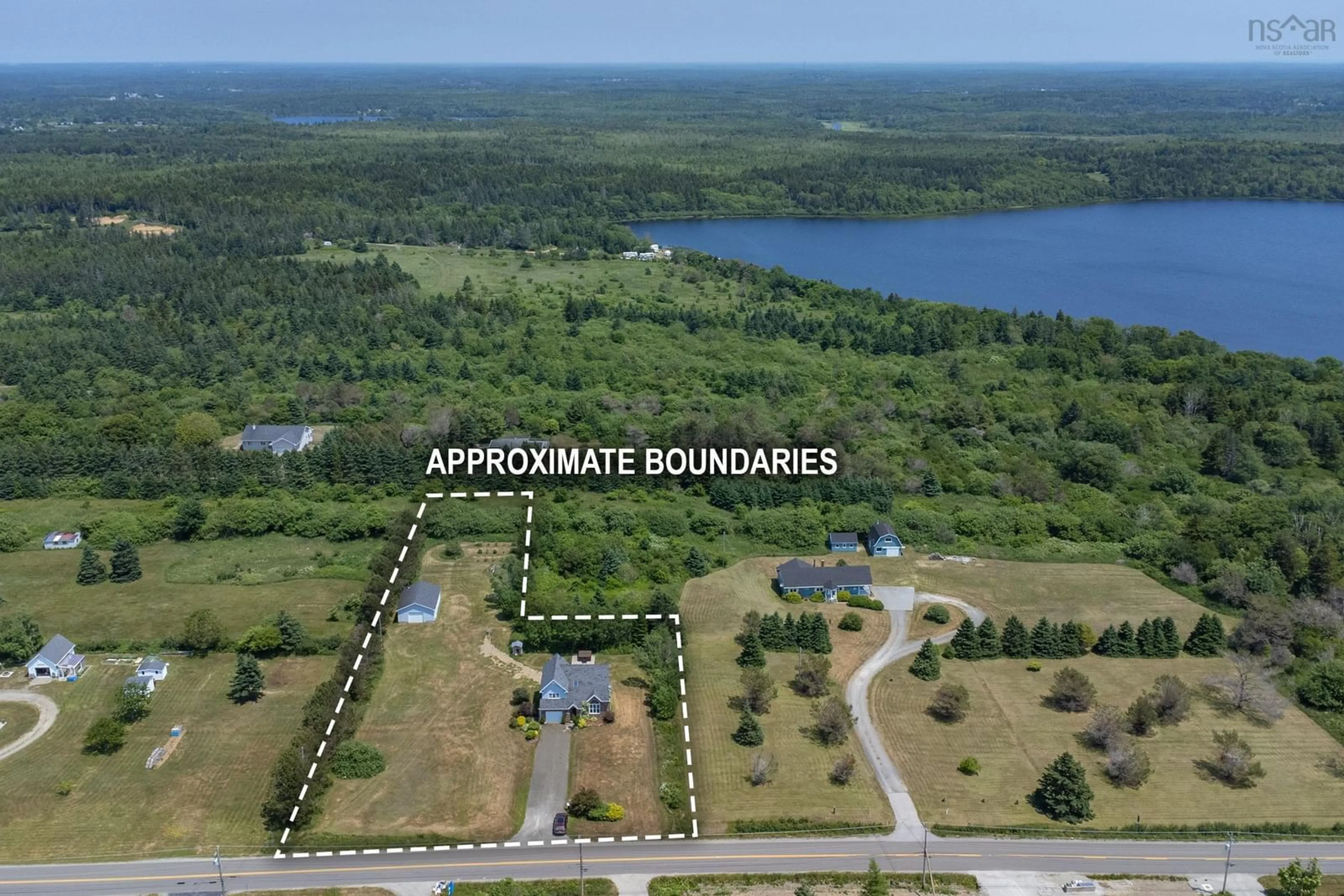 A pic from outside/outdoor area/front of a property/back of a property/a pic from drone, water/lake/river/ocean view for 343 Peter Dugas Rd, Meteghan Nova Scotia B0W 2J0