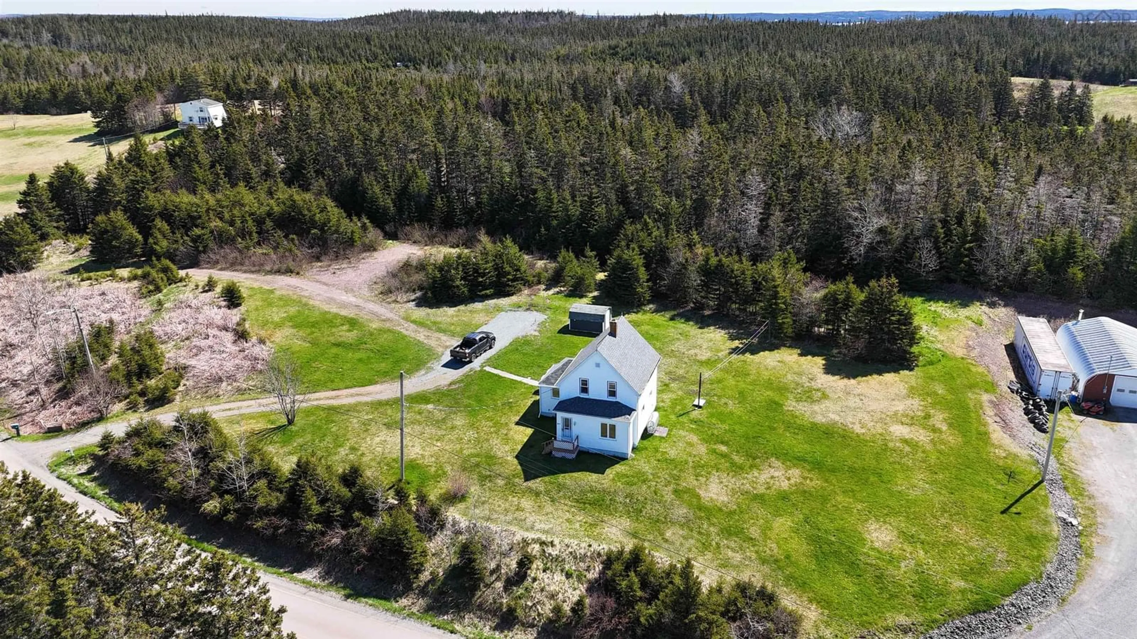 A pic from outside/outdoor area/front of a property/back of a property/a pic from drone, unknown for 95 Church Point Rd, River Bourgeois Nova Scotia B0E 2X0