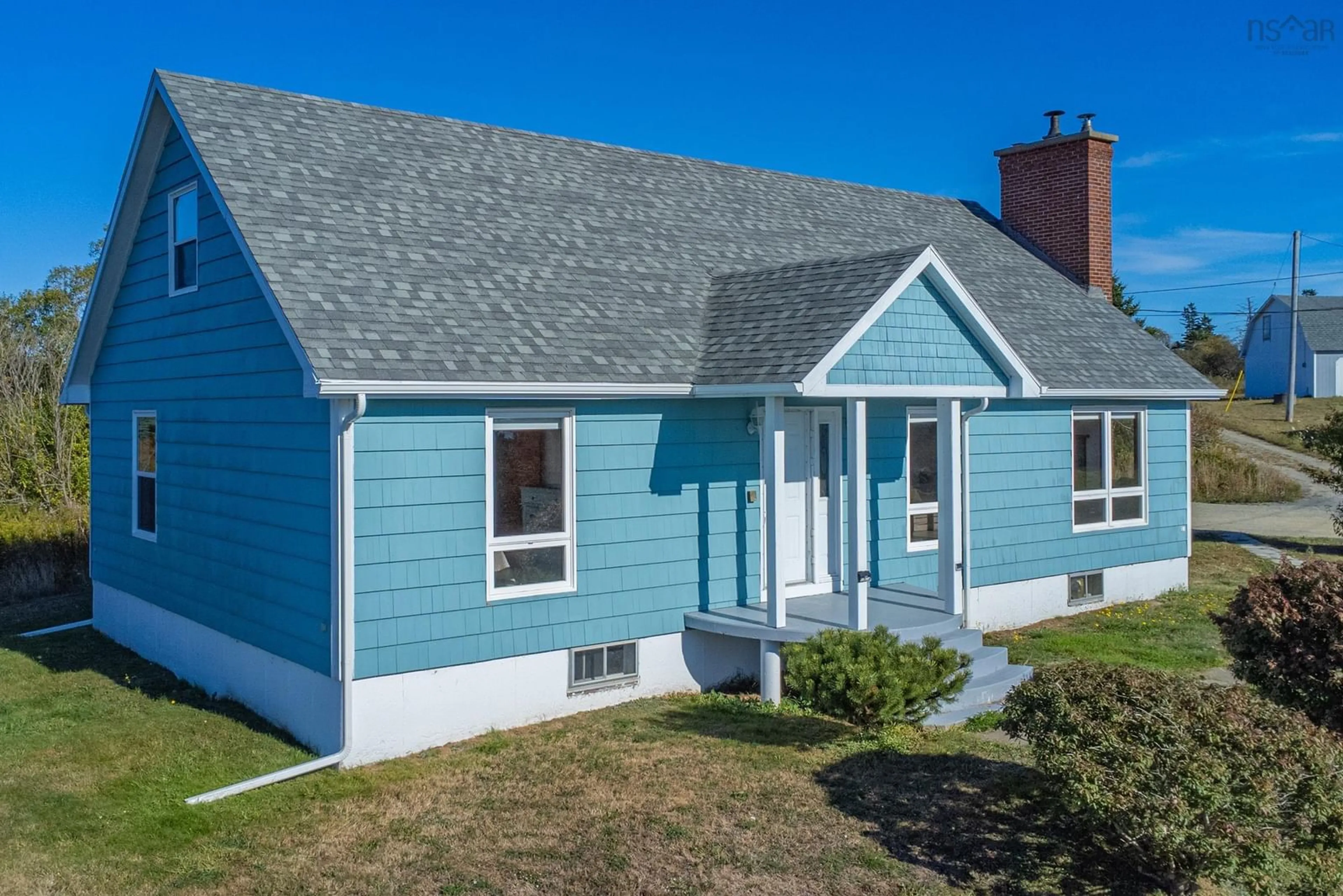 Home with vinyl exterior material, street for 5956 Highway 1, Mavillette Nova Scotia B5A 5B3