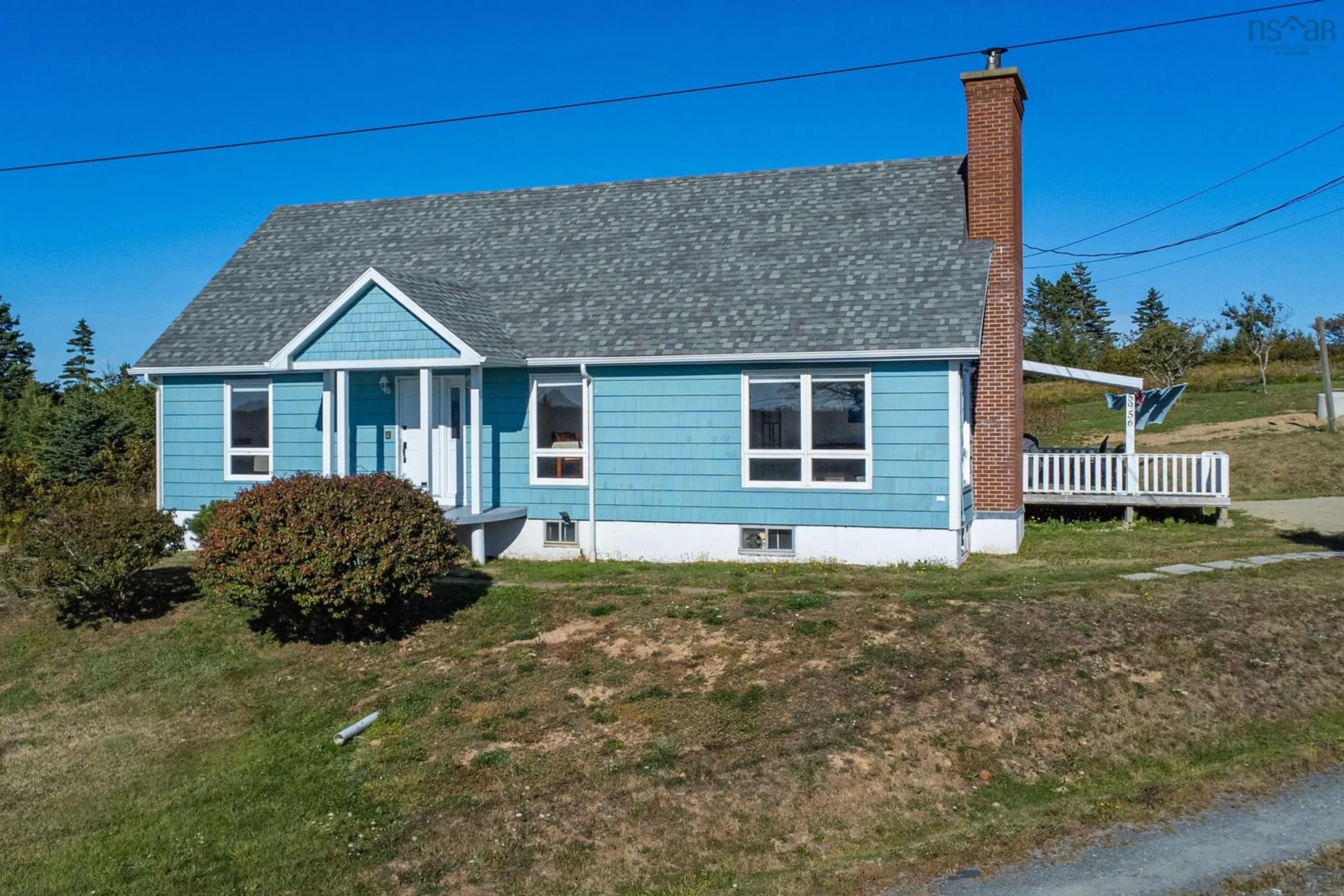 Home with vinyl exterior material, street for 5956 Highway 1, Mavillette Nova Scotia B5A 5B3