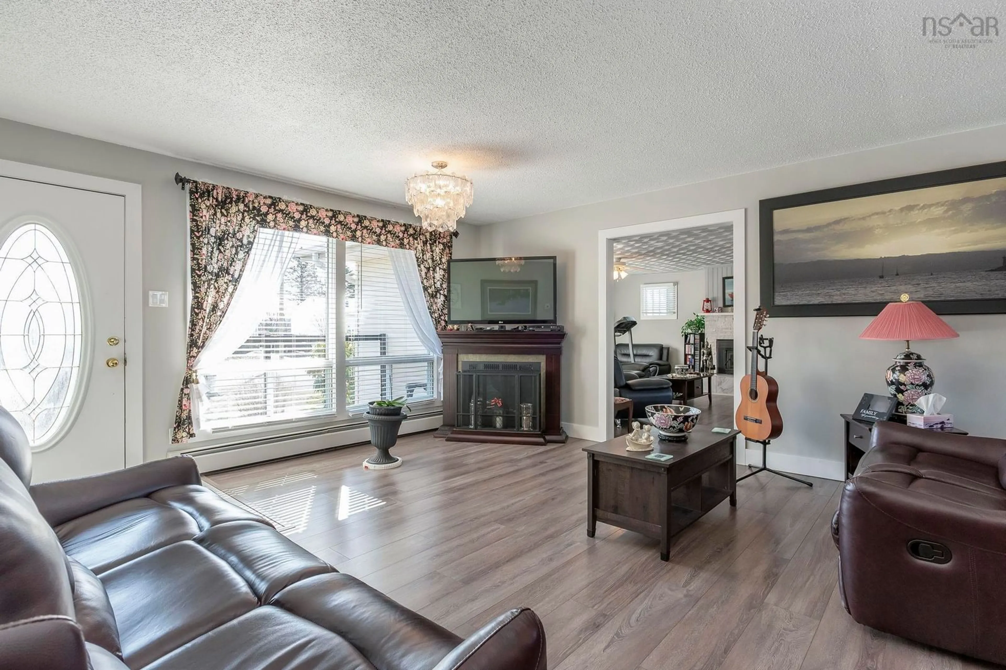 Living room with furniture, wood/laminate floor for 29 Queen St, Digby Nova Scotia B0V 1A0