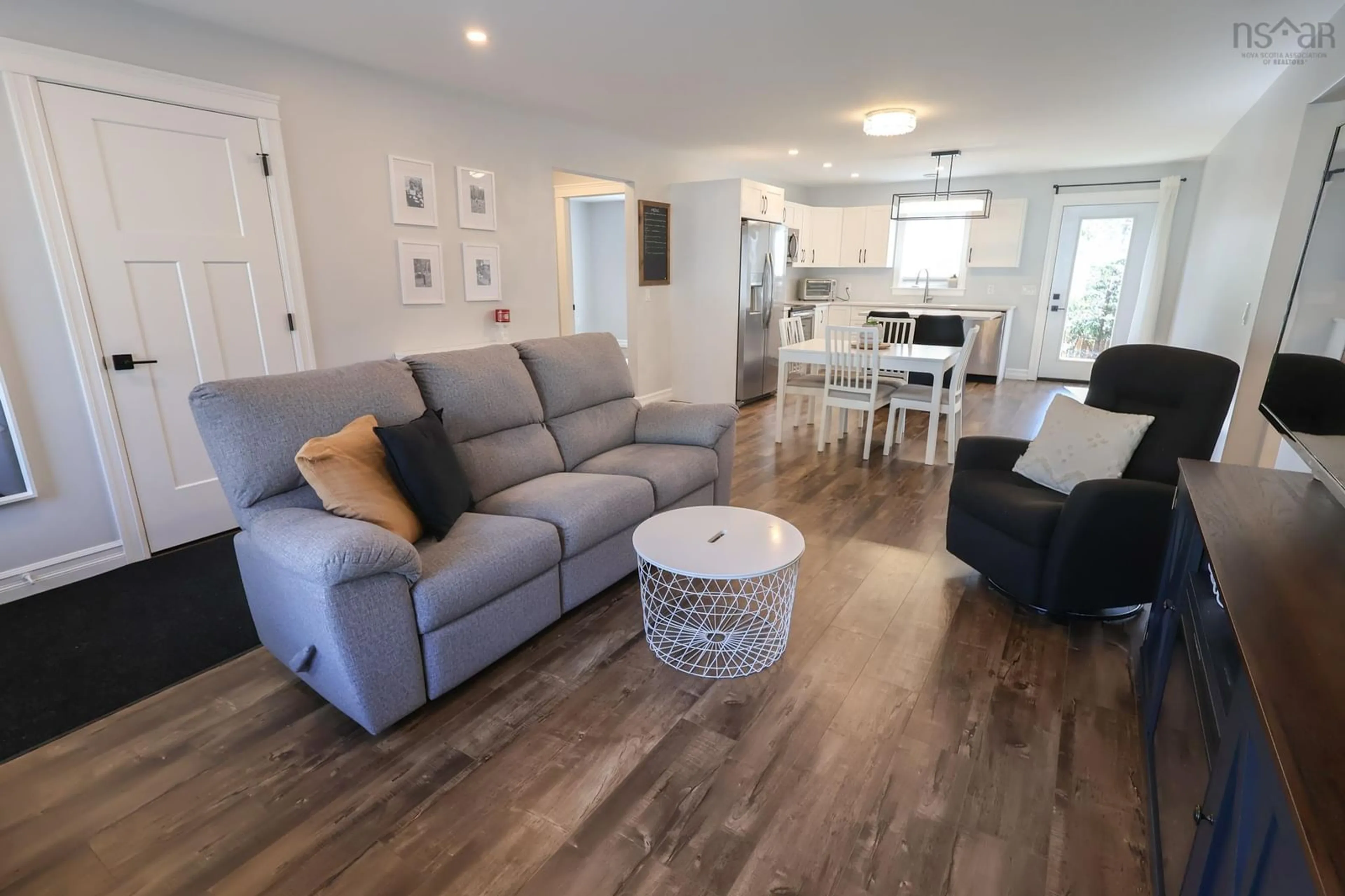 Living room with furniture, wood/laminate floor for 235 Winburn Ave, Bridgewater Nova Scotia B4V 4A2