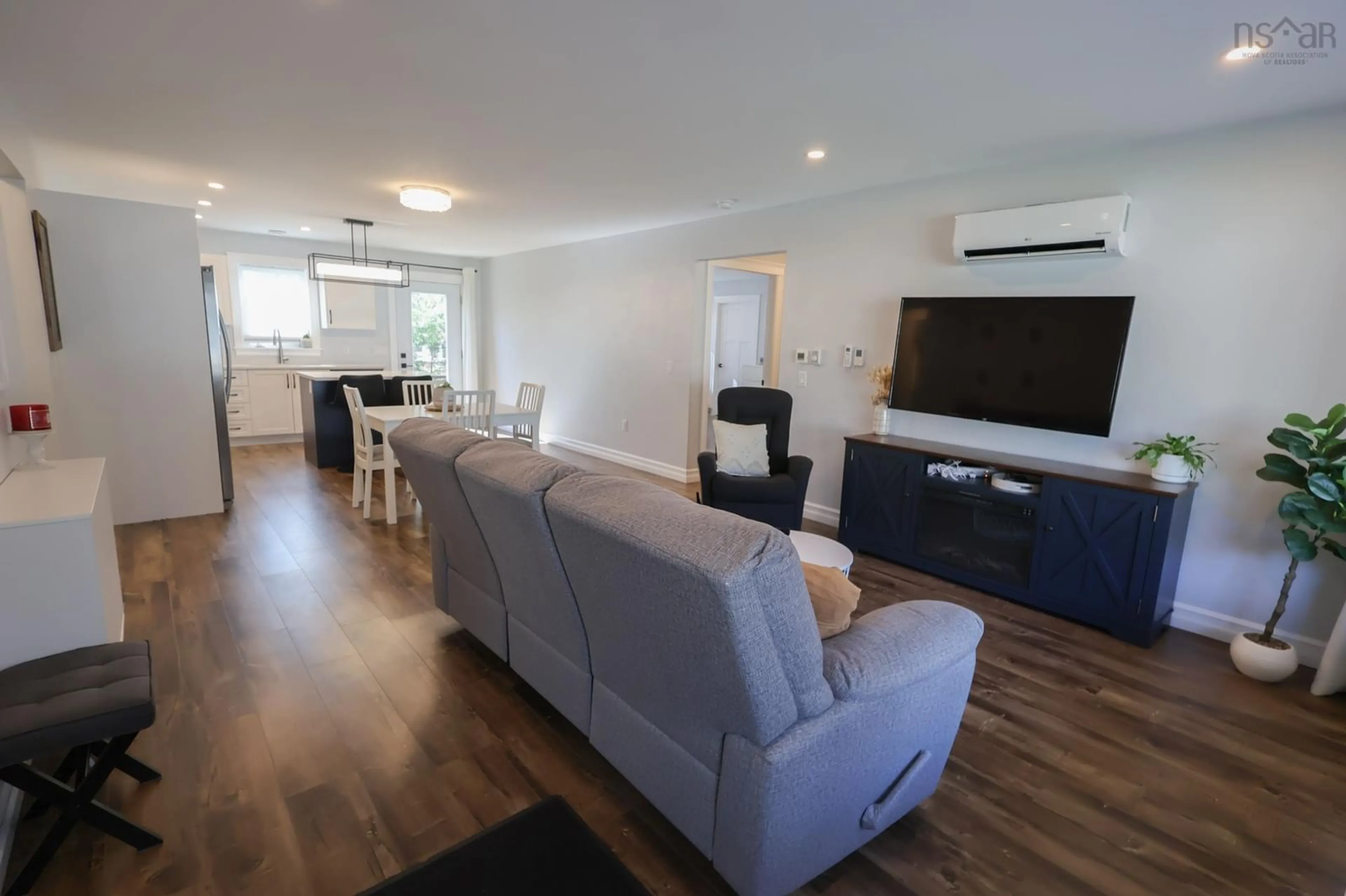 Living room with furniture, wood/laminate floor for 235 Winburn Ave, Bridgewater Nova Scotia B4V 4A2