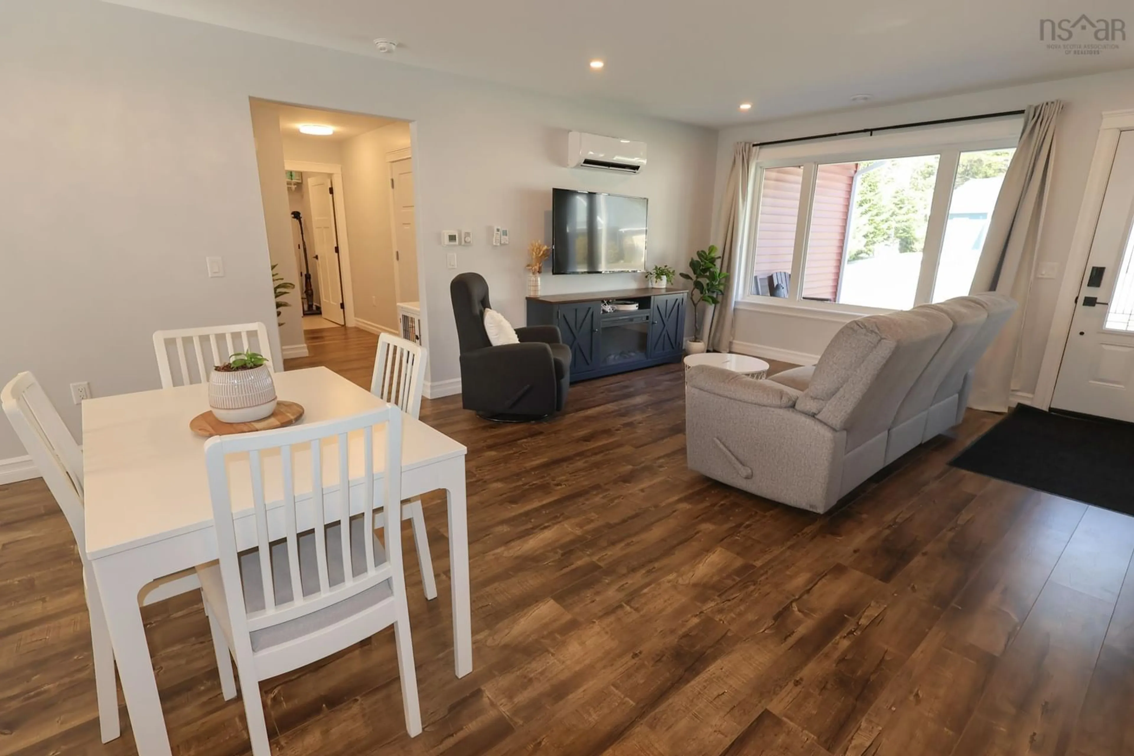 Living room with furniture, wood/laminate floor for 235 Winburn Ave, Bridgewater Nova Scotia B4V 4A2