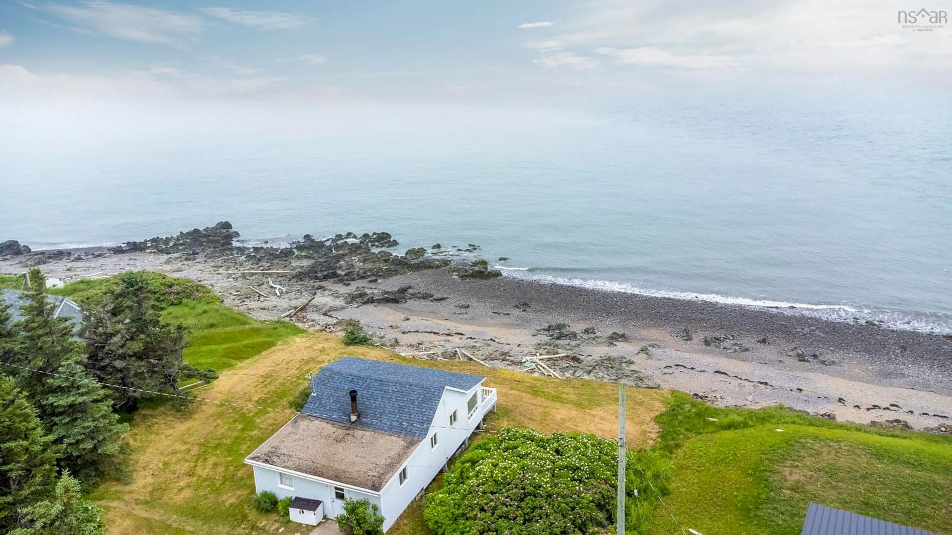 A pic from outside/outdoor area/front of a property/back of a property/a pic from drone, water/lake/river/ocean view for 9 Gordon Road, Margaretsville Nova Scotia B0S 1N0