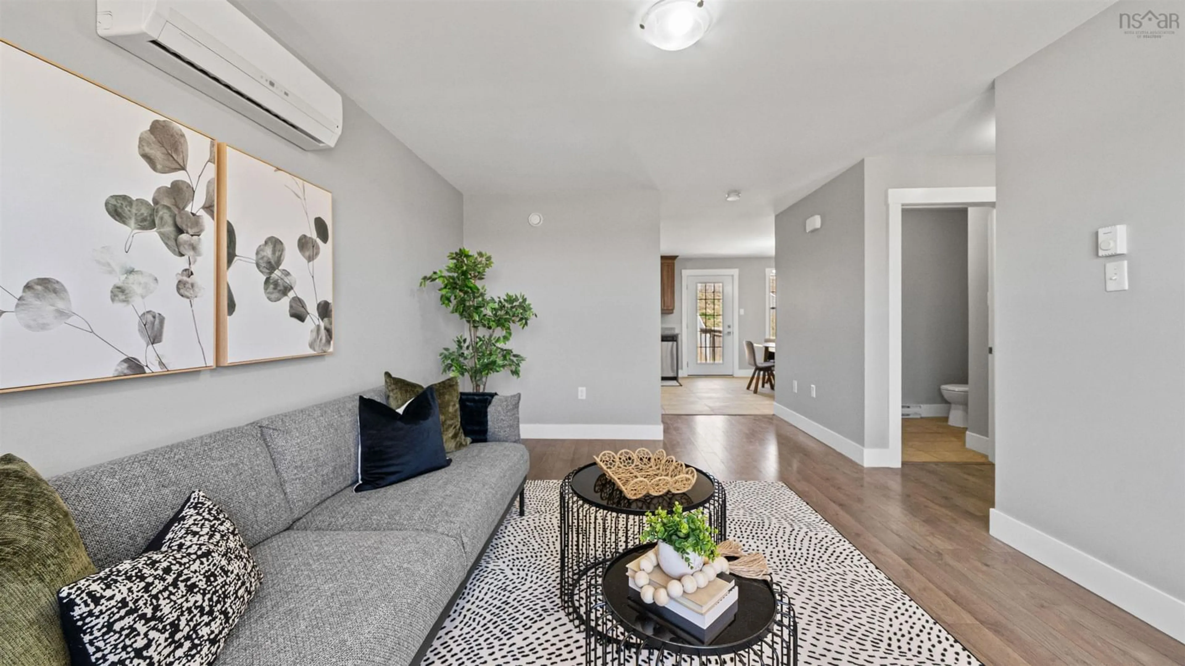 Living room with furniture, wood/laminate floor for 63 Fescue Crt, Middle Sackville Nova Scotia B4E 0L7
