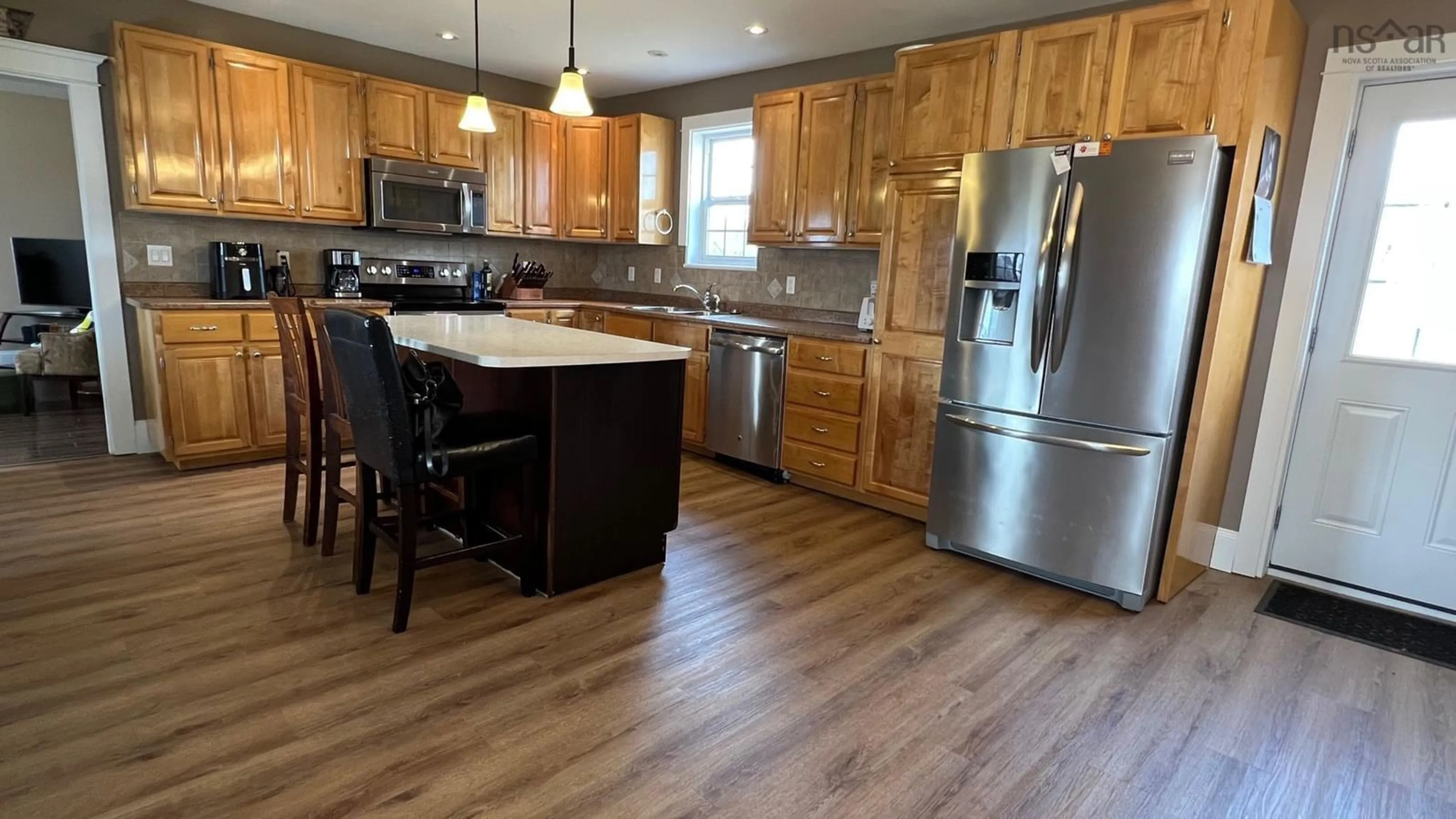 Open concept kitchen, wood/laminate floor for 13 Lornevale Rd, Great Village Nova Scotia B0M 1L0