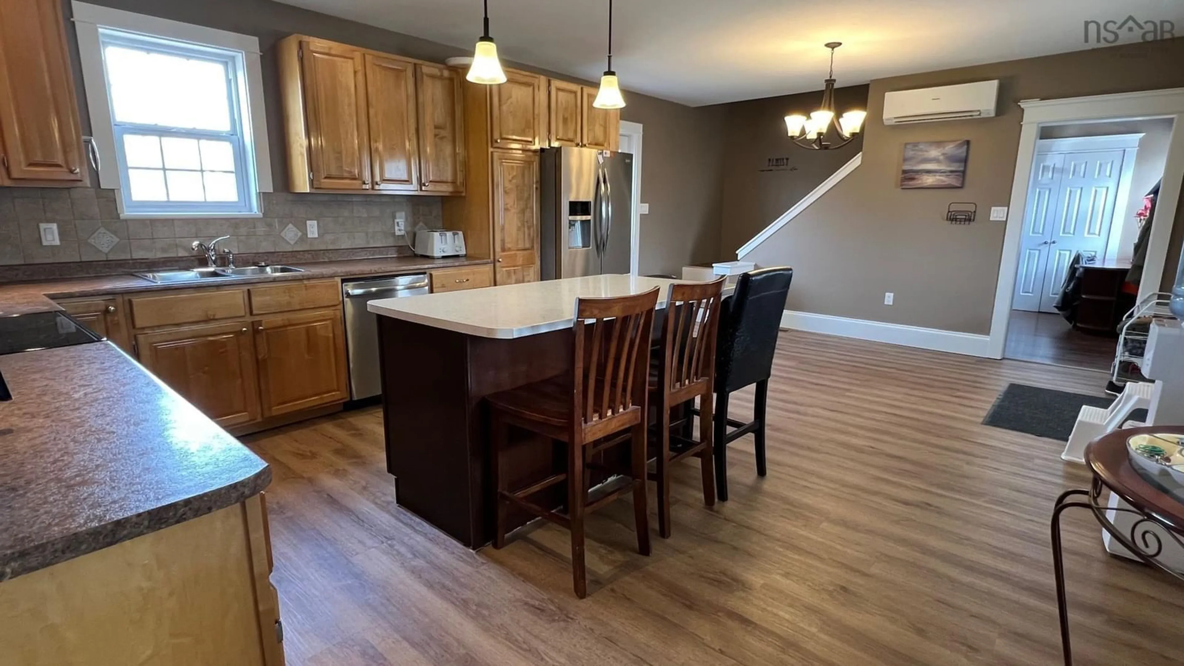 Open concept kitchen, wood/laminate floor for 13 Lornevale Rd, Great Village Nova Scotia B0M 1L0