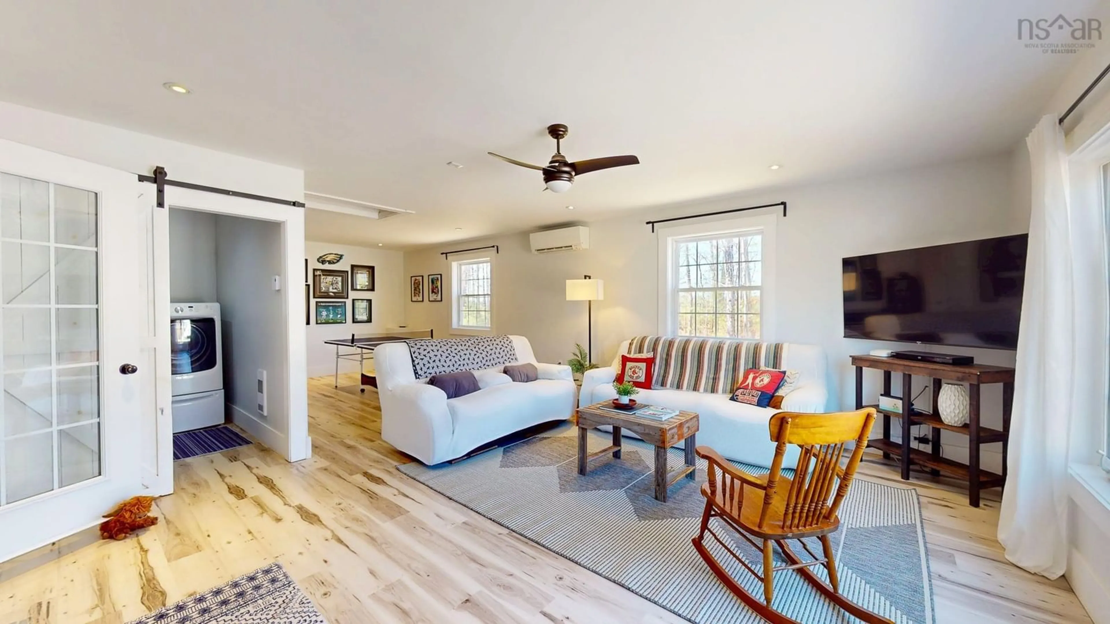 Living room with furniture, wood/laminate floor for 489 Alexander Mackenzie Rd, South Farmington Nova Scotia B0P 1W0
