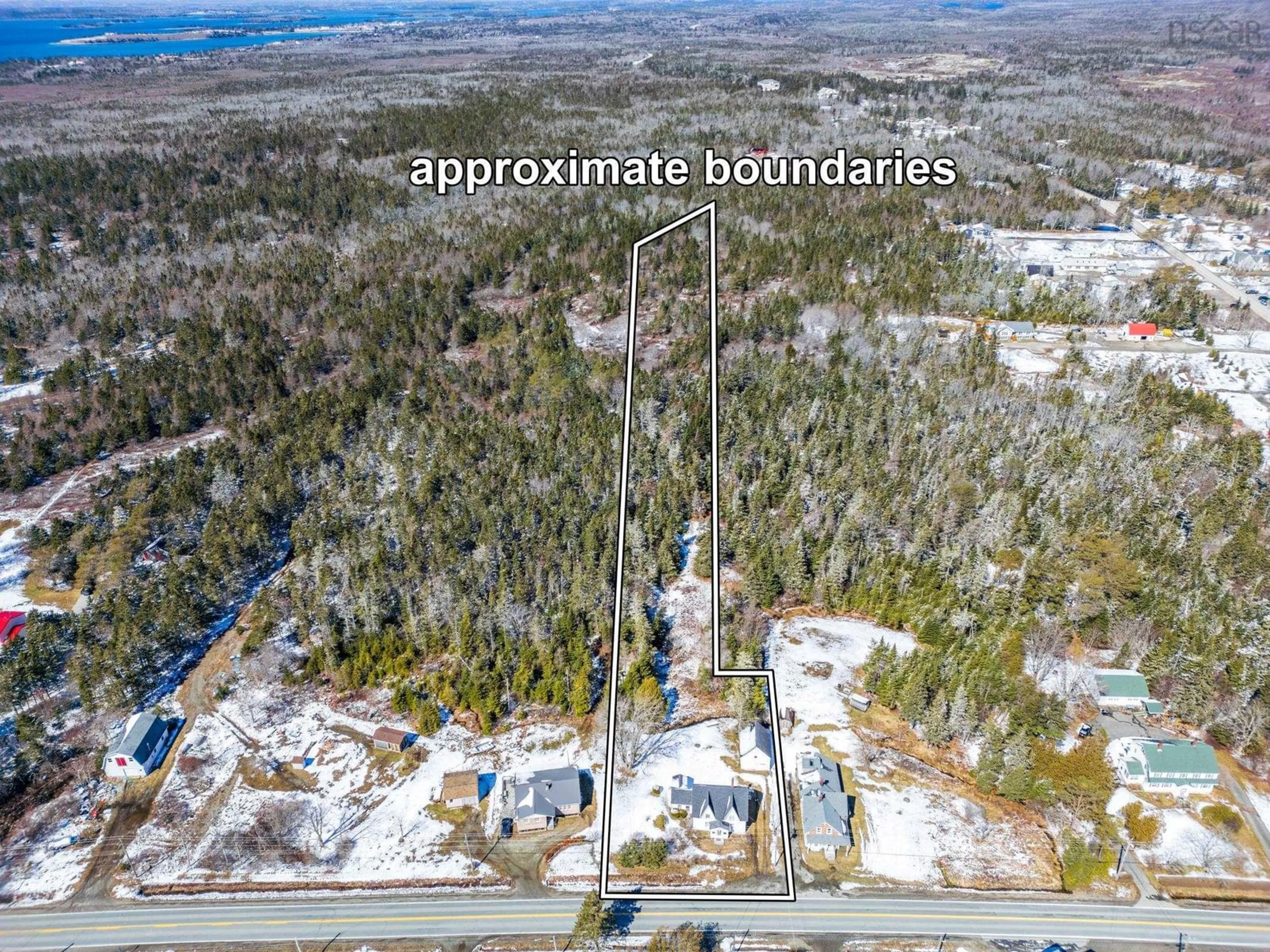 A pic from outside/outdoor area/front of a property/back of a property/a pic from drone, unknown for 46 Highway 335, Pubnico Nova Scotia B0W 3S0